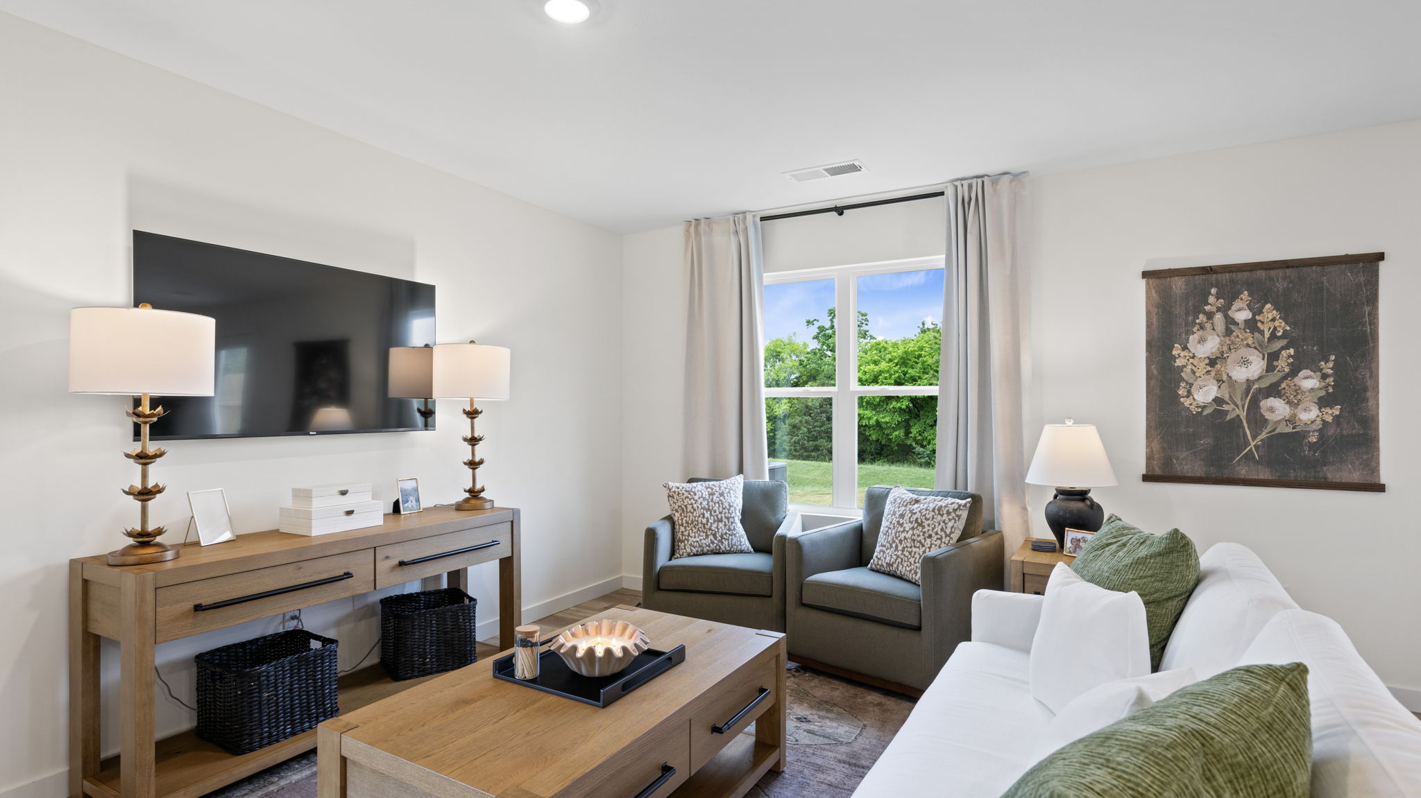 open concept living and dining with windows