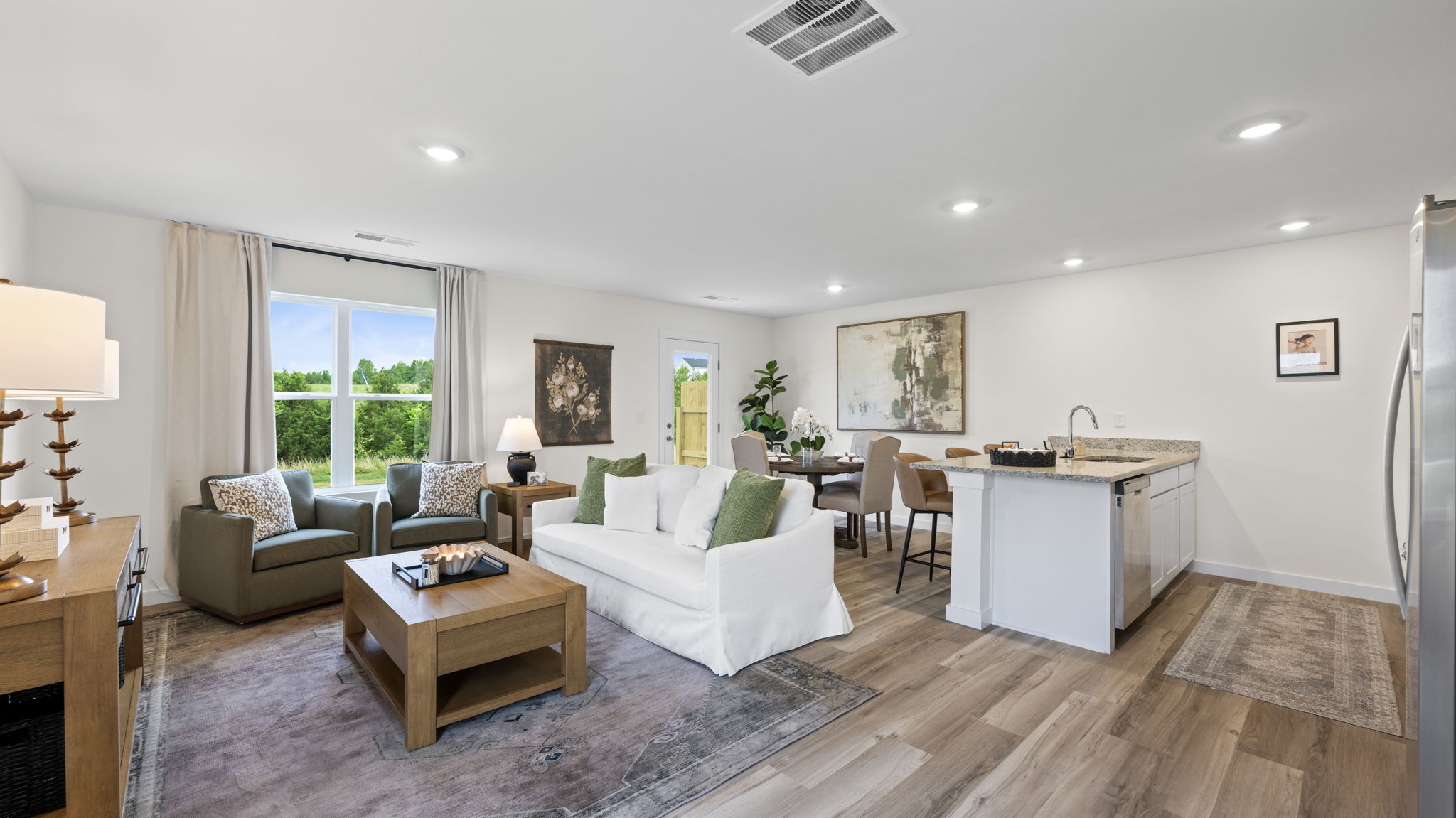 open concept living room with double window