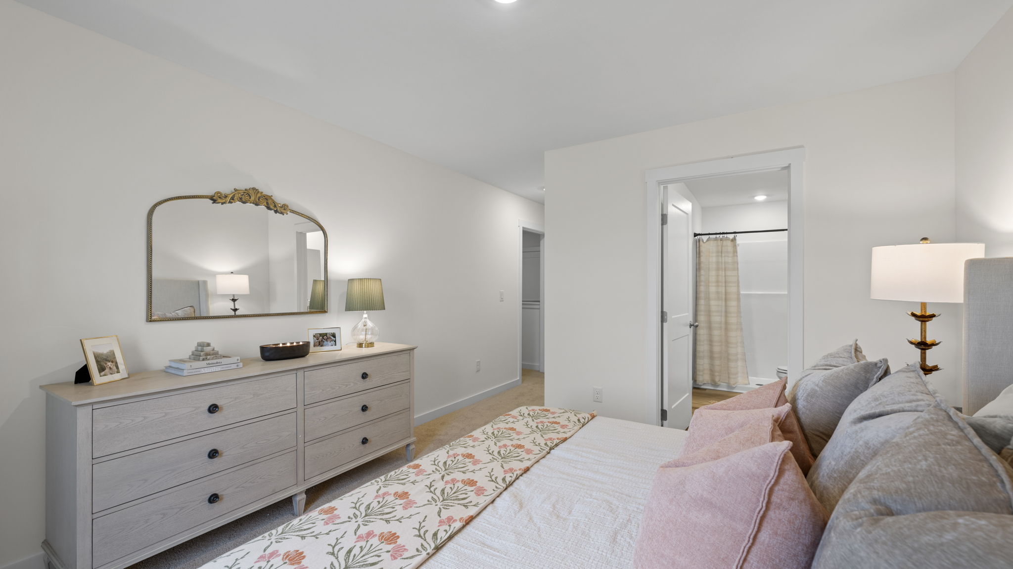 primary bedroom with single window and en suite