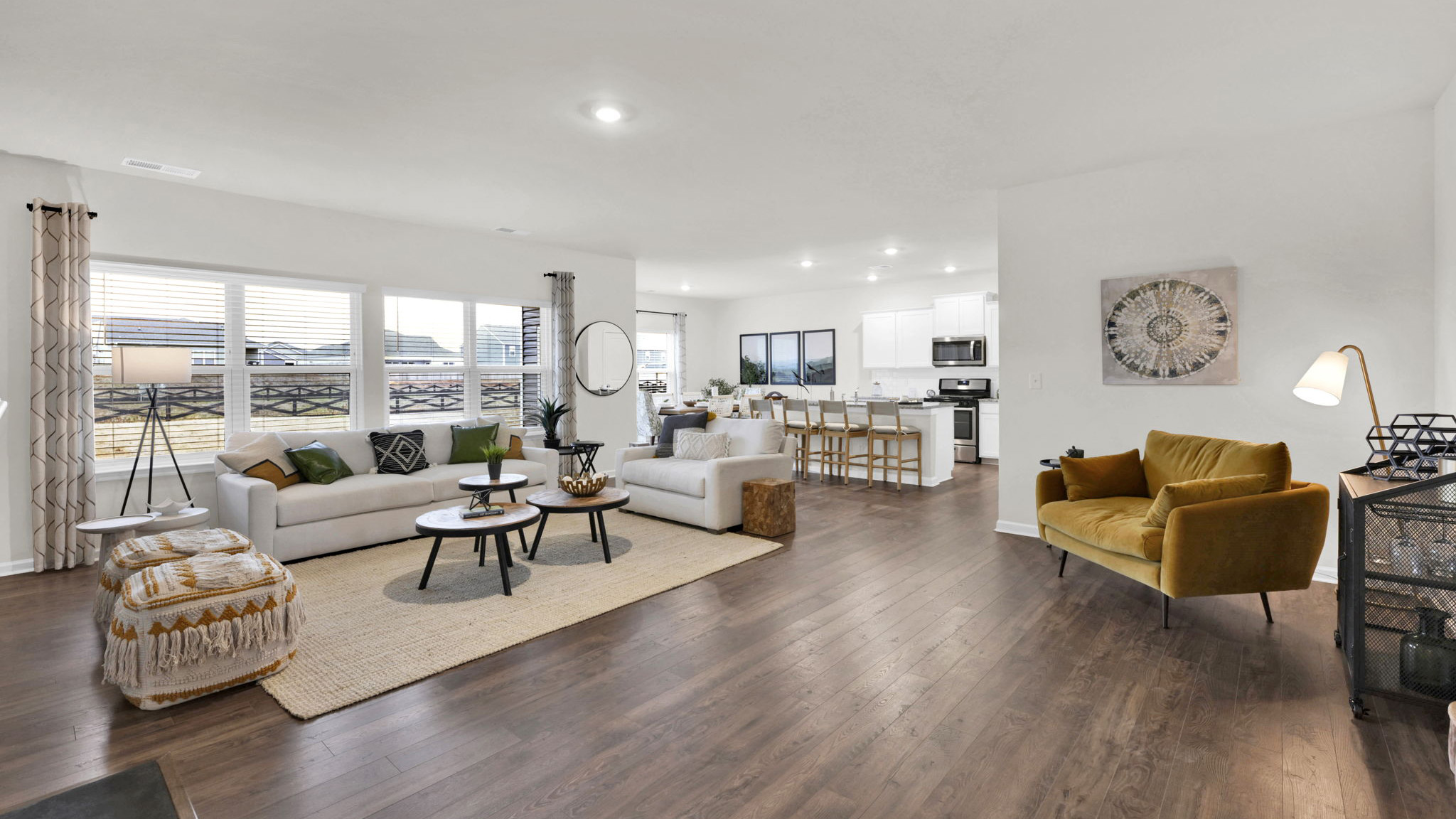 open concept living area with two double windows