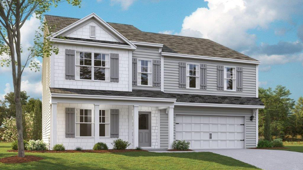 Two story home with two car garage and stone