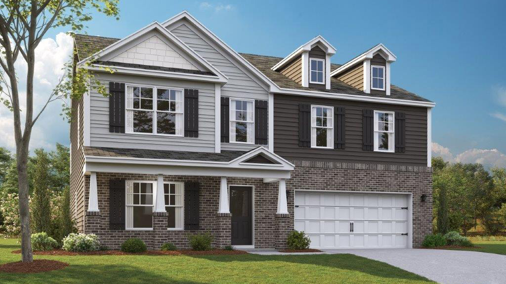 Two story home with two car garage and stone