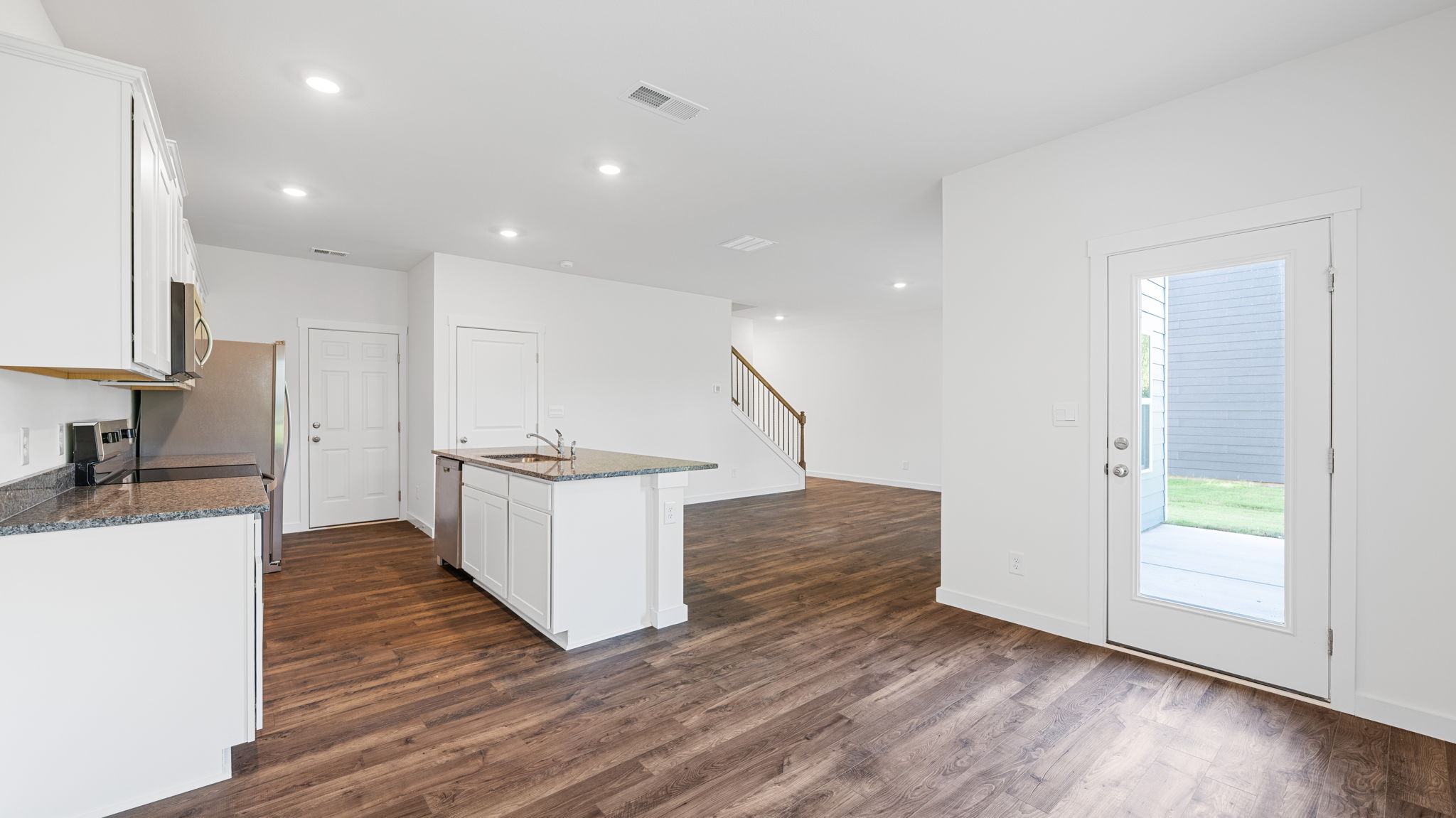 Kitchen with quartz countertop and stainless steel appliances