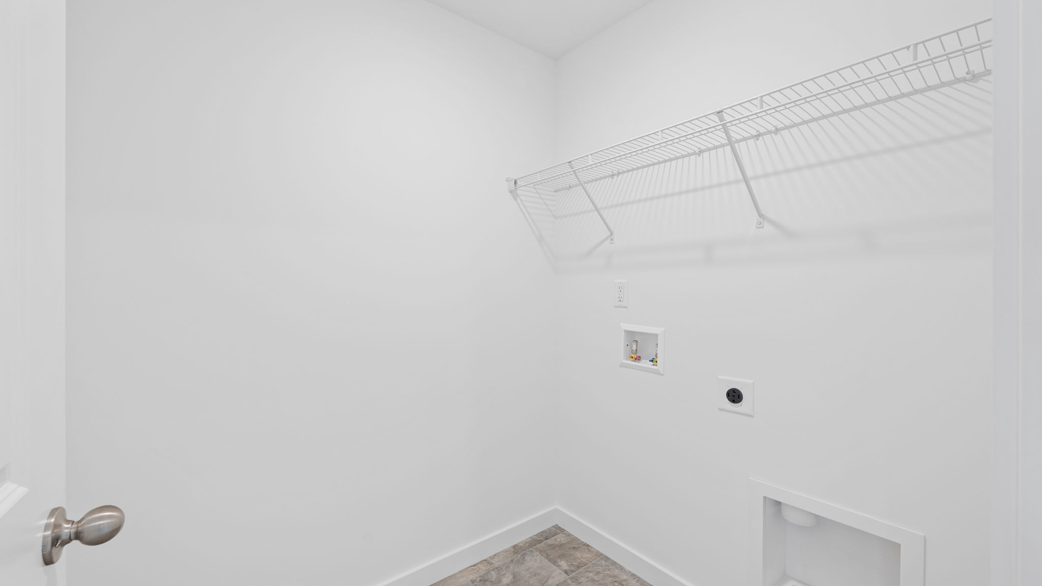 Laundry room with shelving