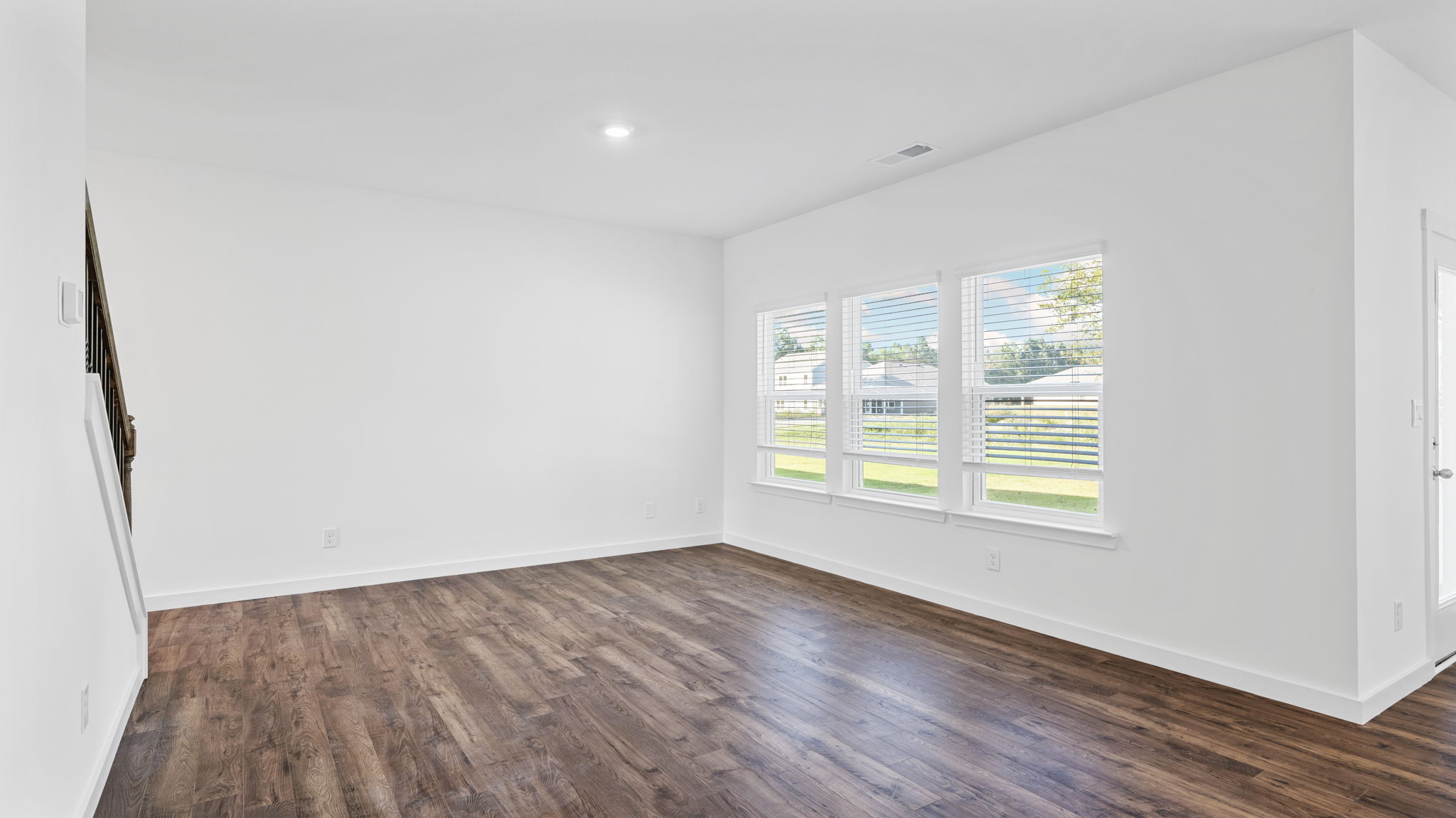Open concept living area with double window