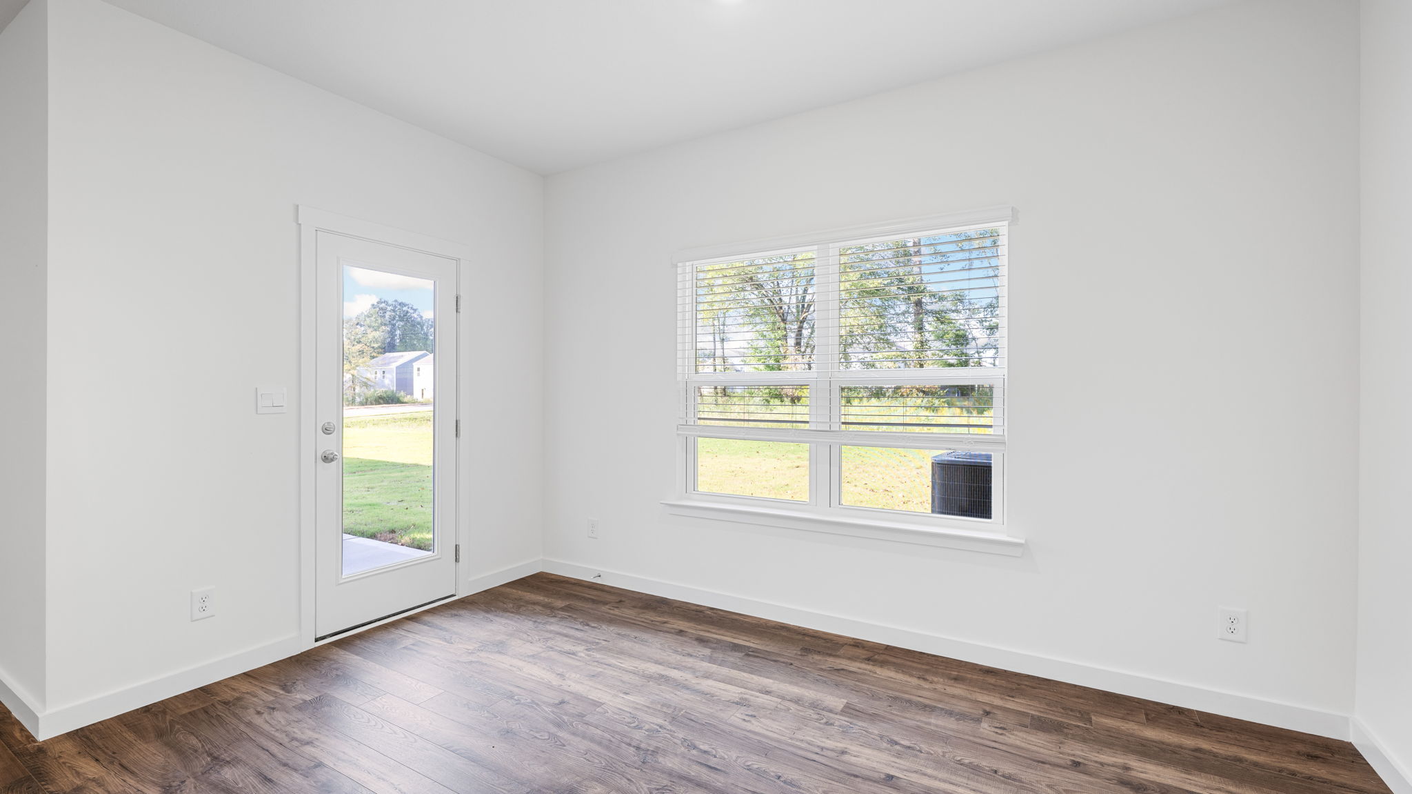 Dining area off kitchen with two large windows