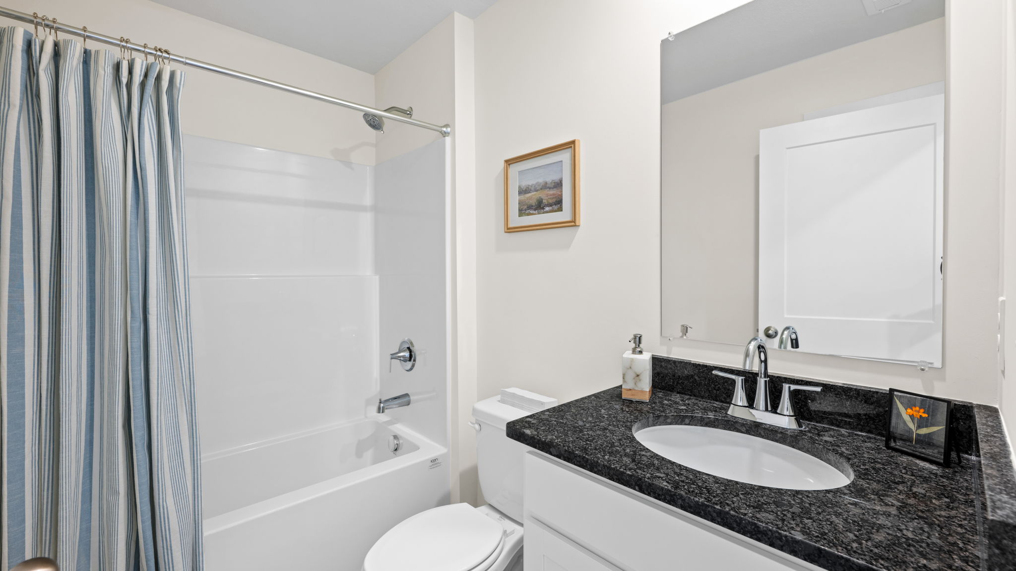 full bathroom with single vanity and shower/ tub duo