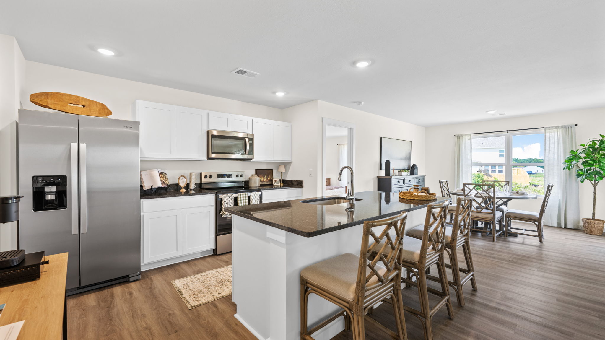 open concept kitchen with large island and stainless steel appliances