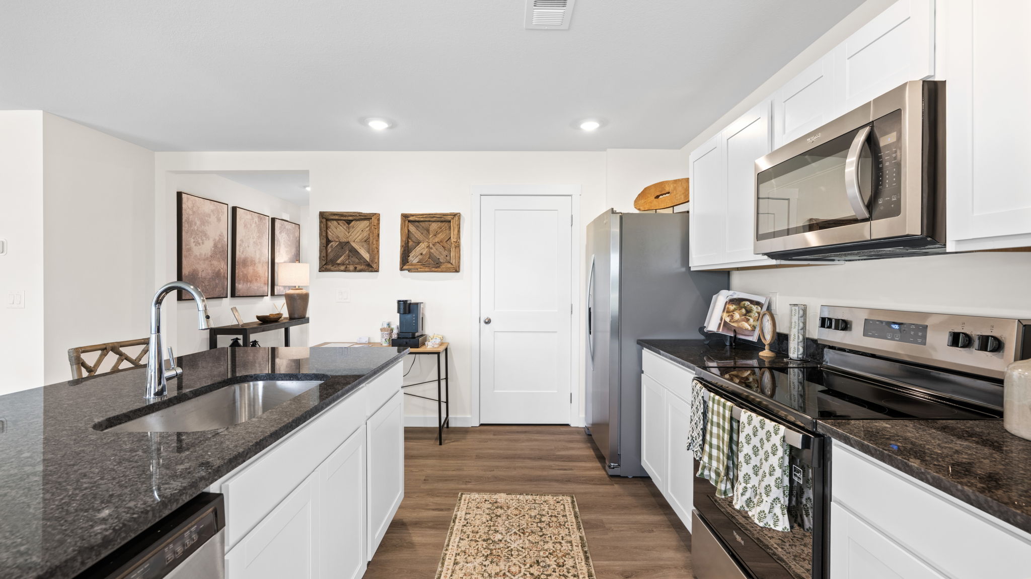 open concept kitchen with large island and stainless steel appliances