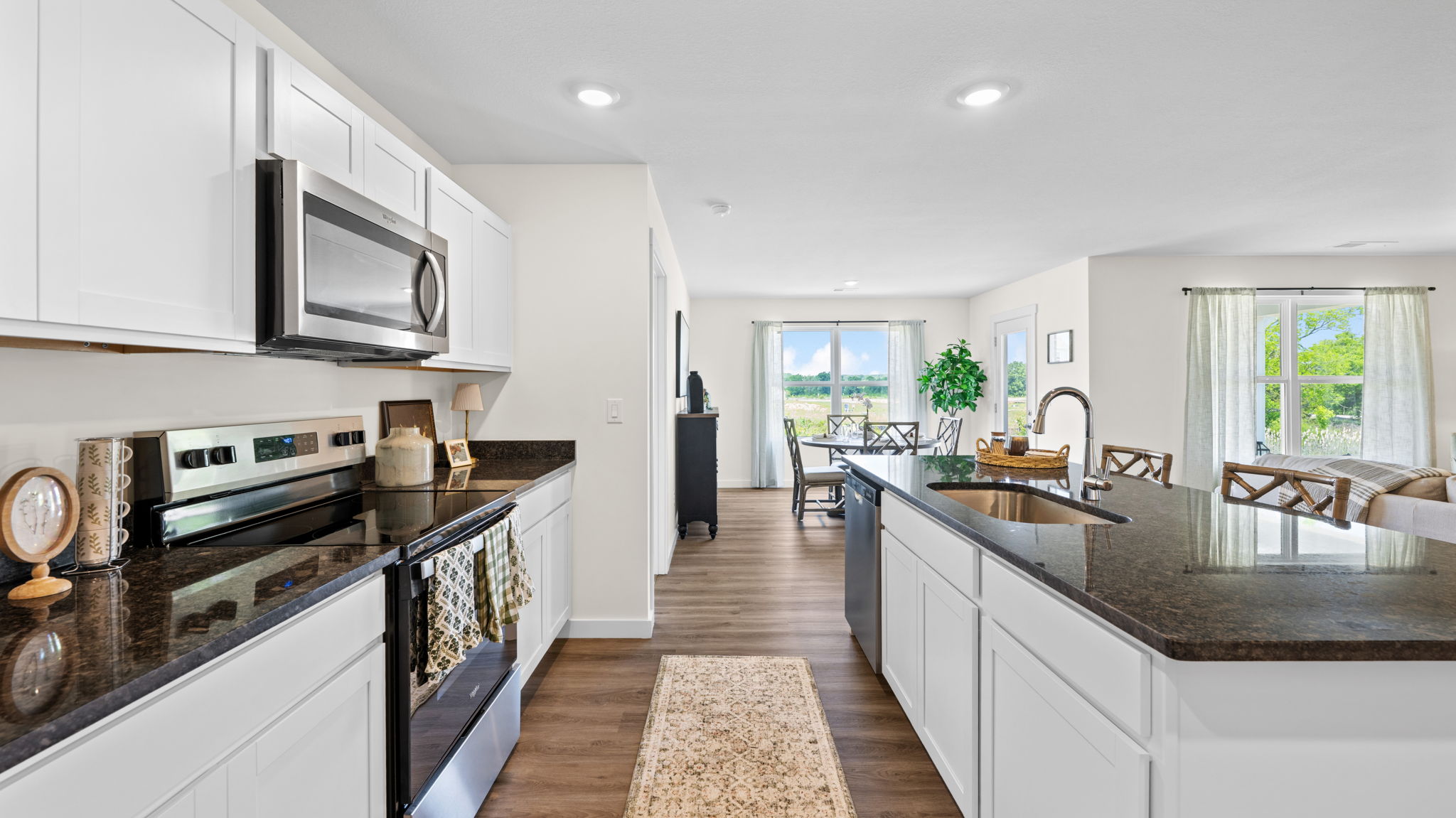 open concept kitchen with large island and stainless steel appliances