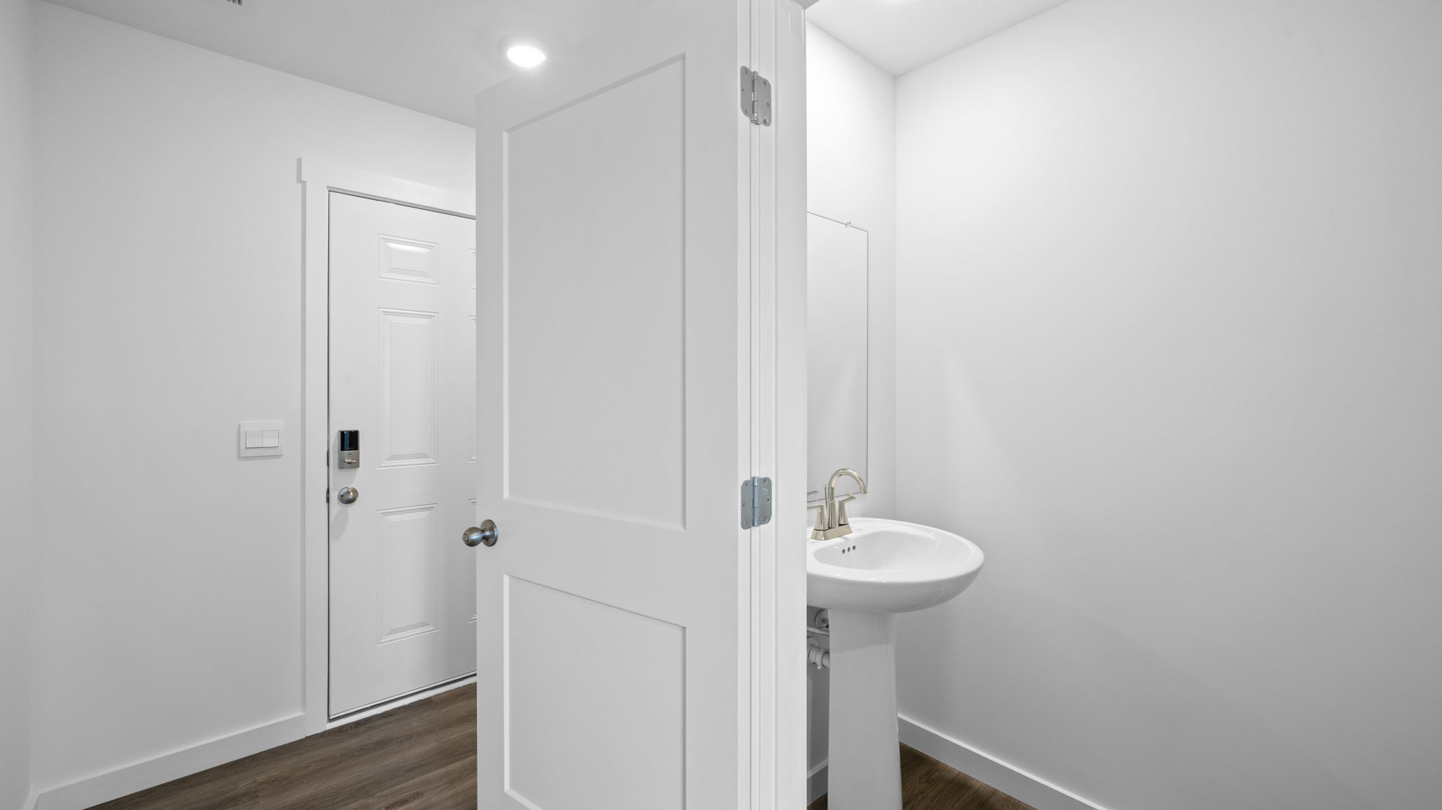 entryway hallway with half bathroom