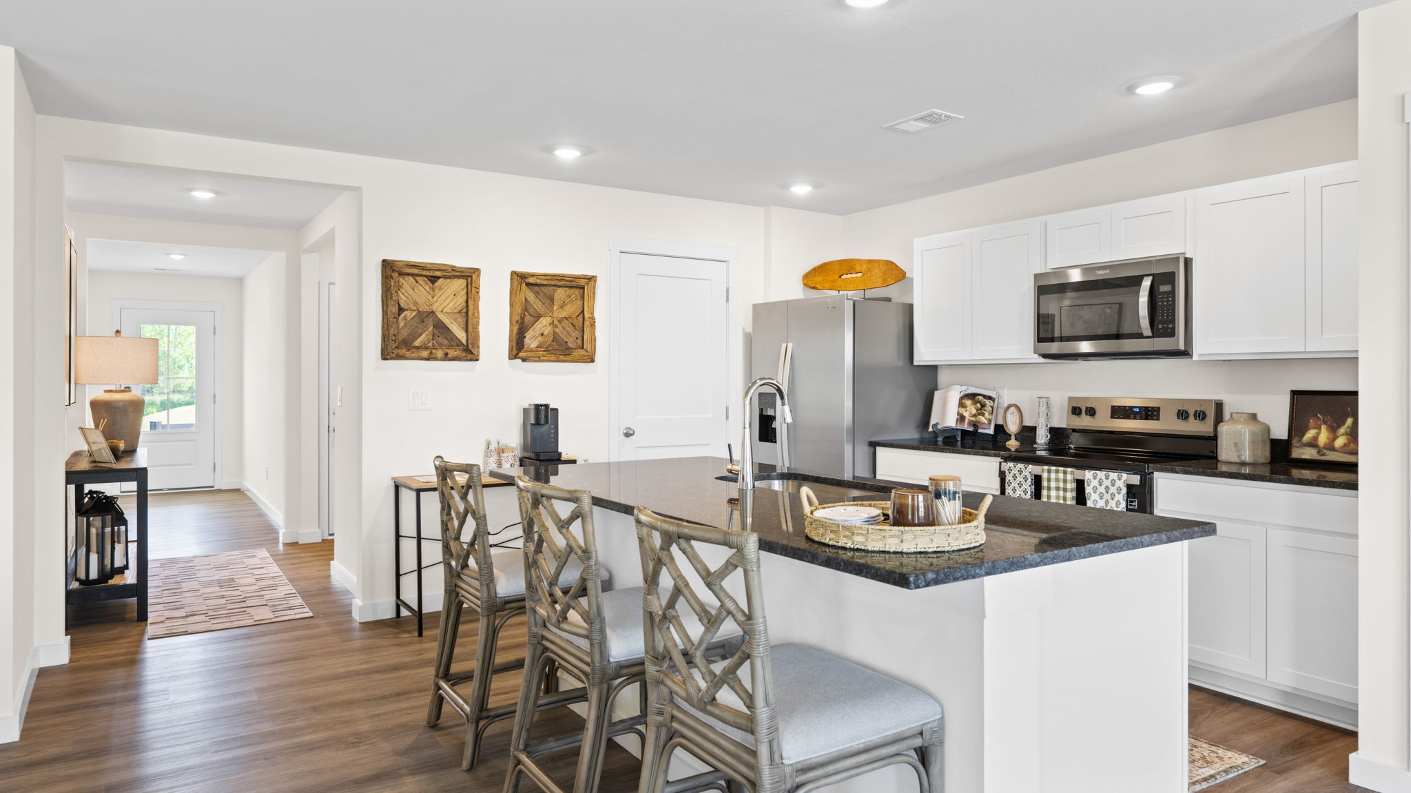 open concept kitchen with large island and stainless steel appliances