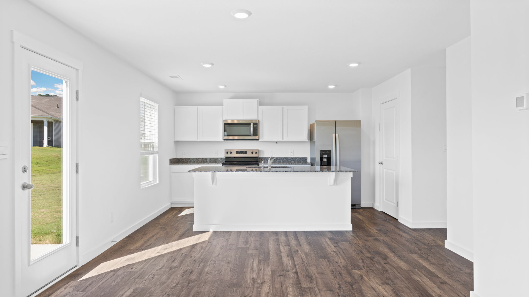 open concept living room with double window