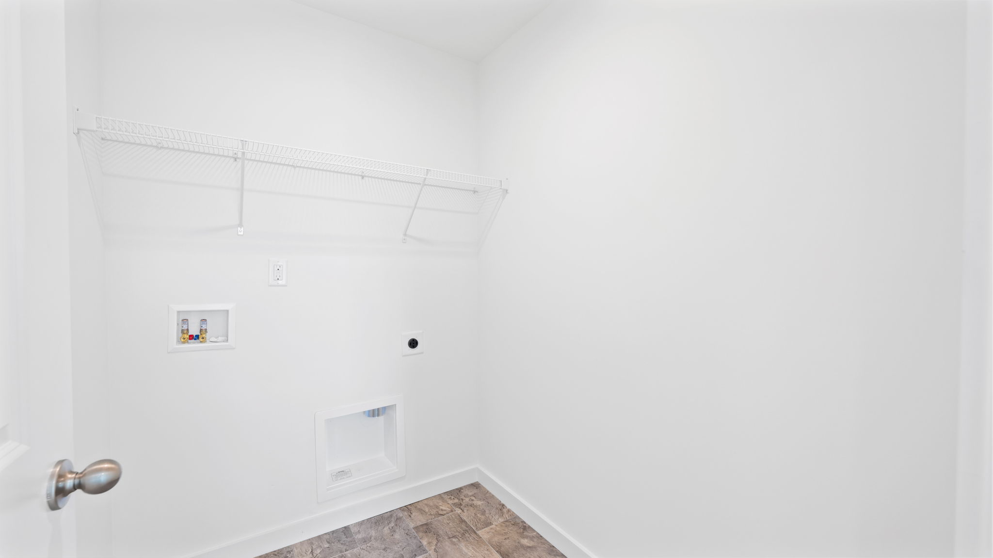 laundry room with shelving