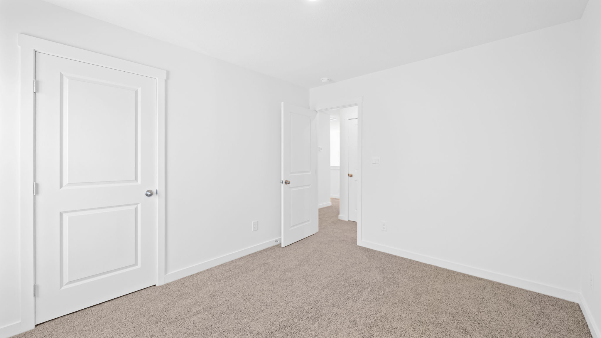 bedroom with single window and walk-in closet