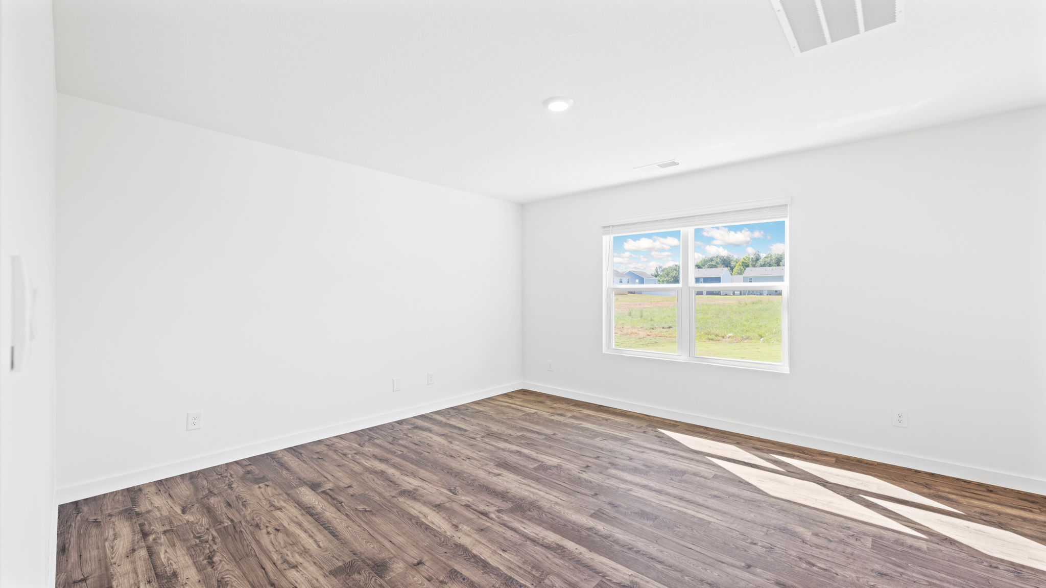 open concept living room with double window