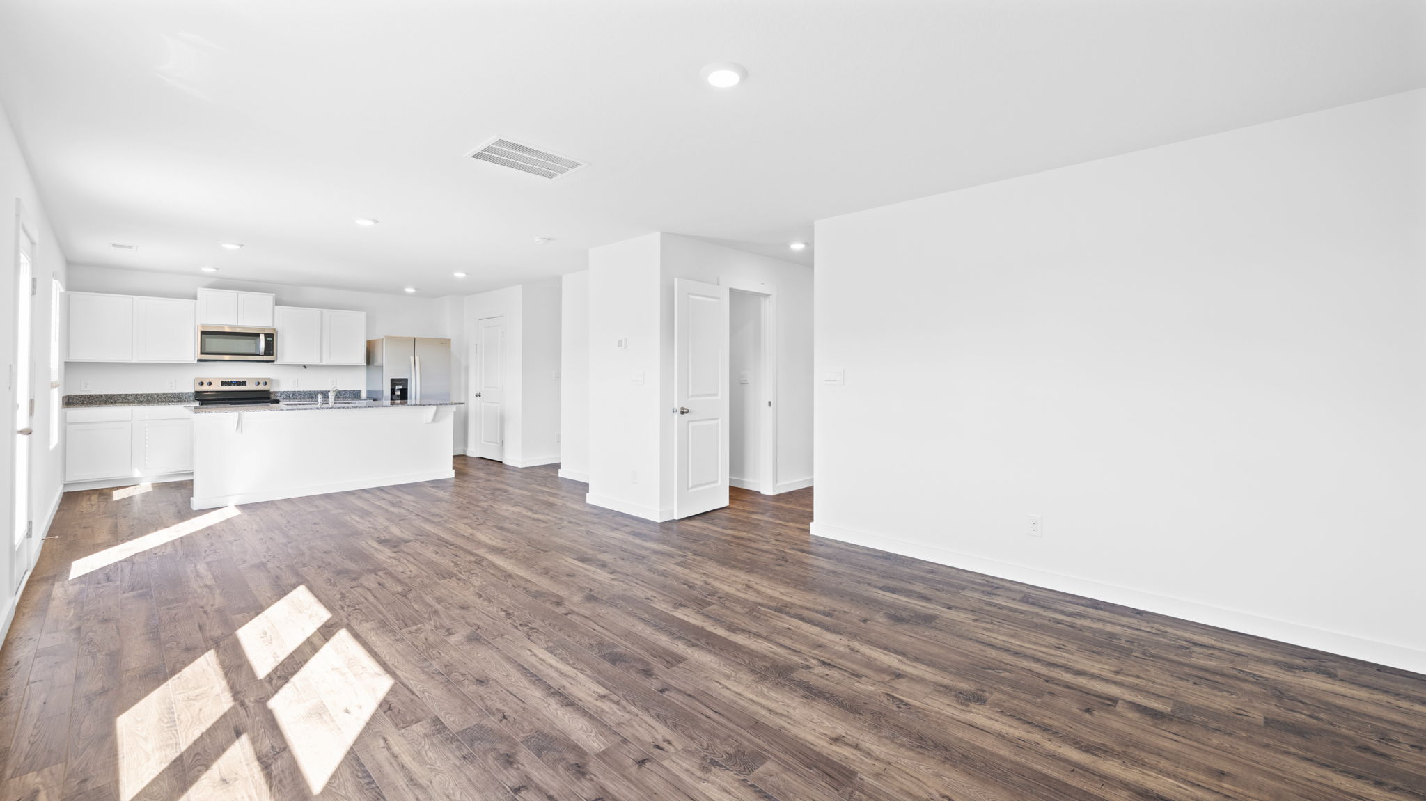 open concept living room with double window