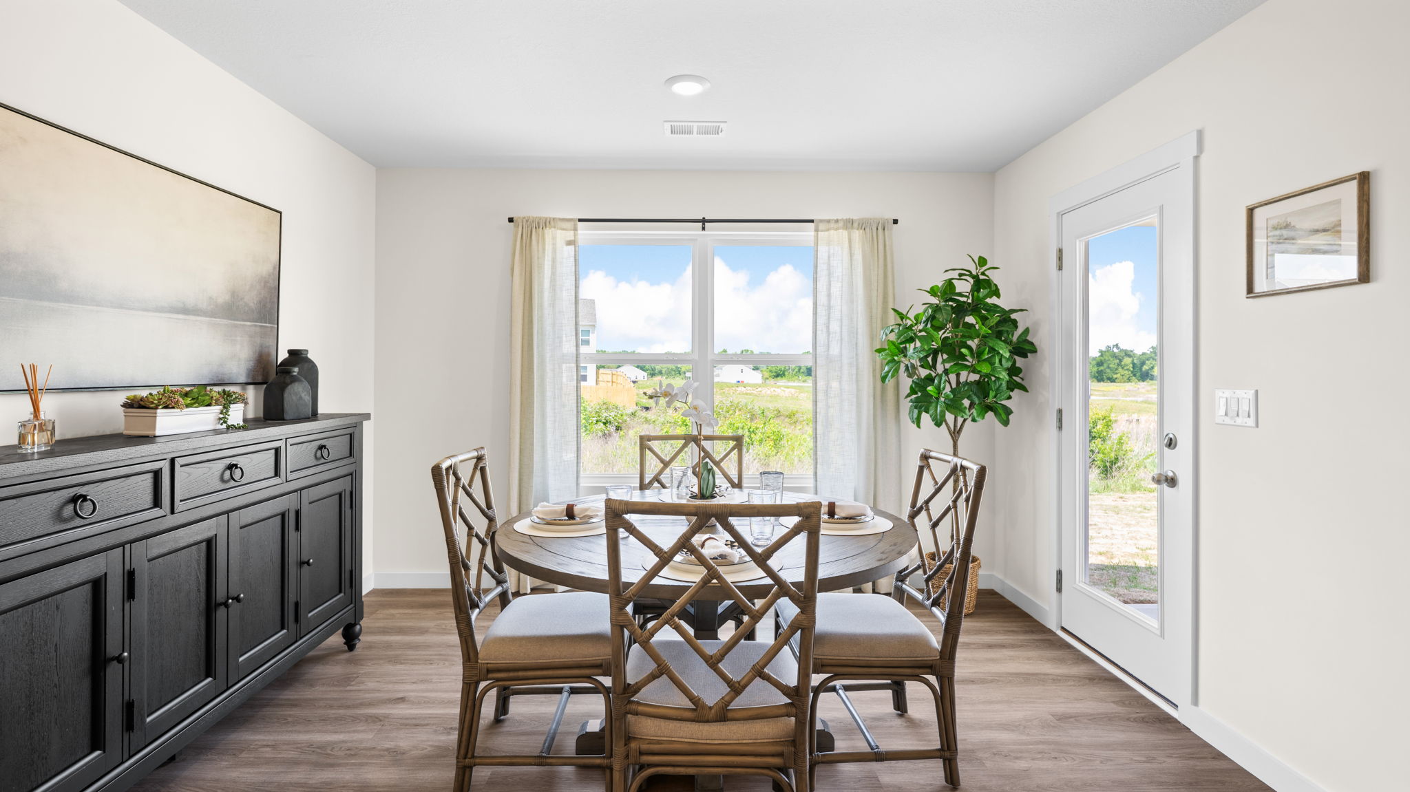 dining area with double window and back patio door