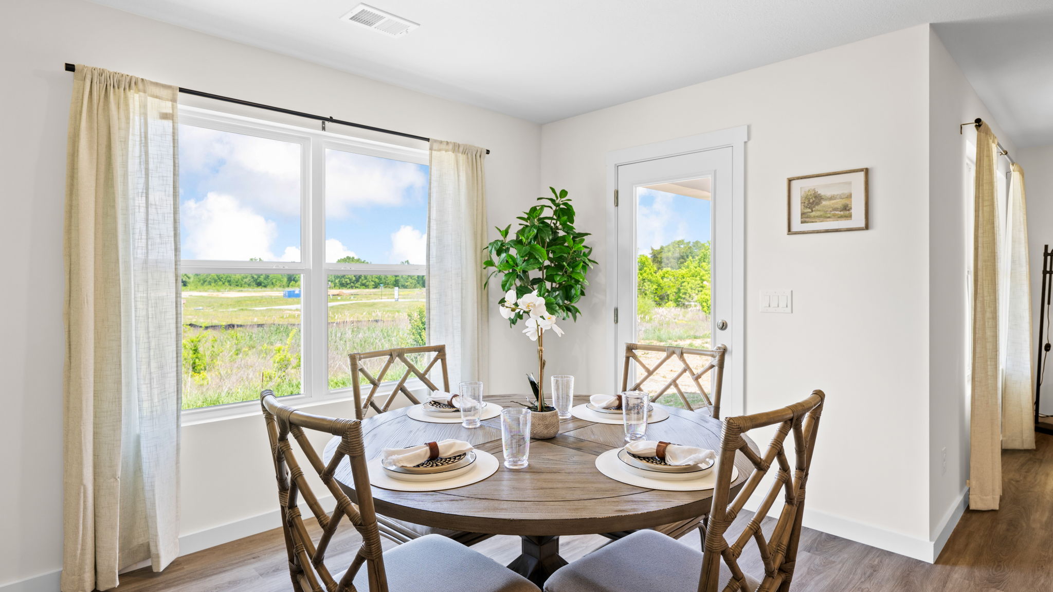 dining area with double window and back patio door