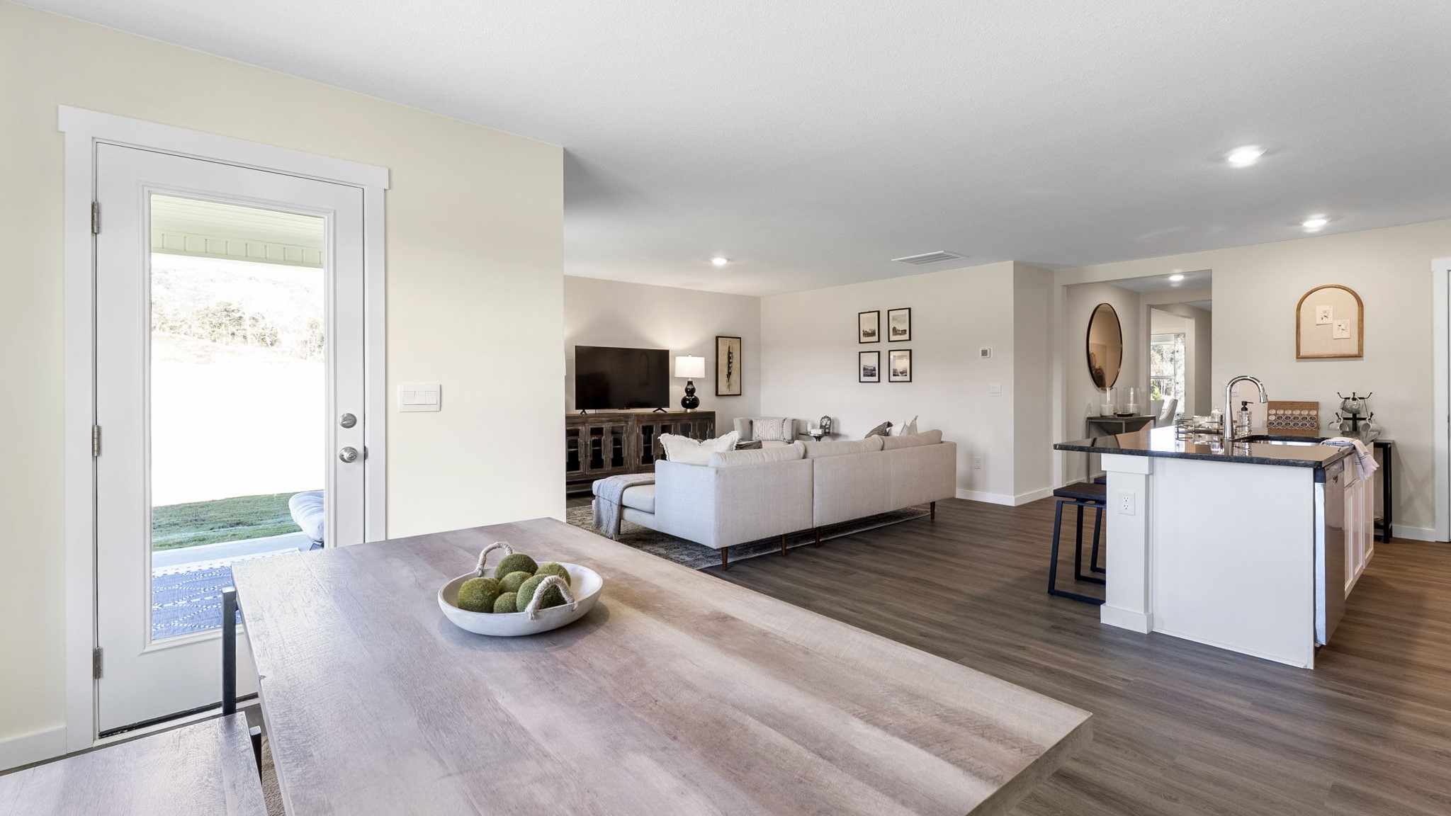 open concept dining with double window and back patio door