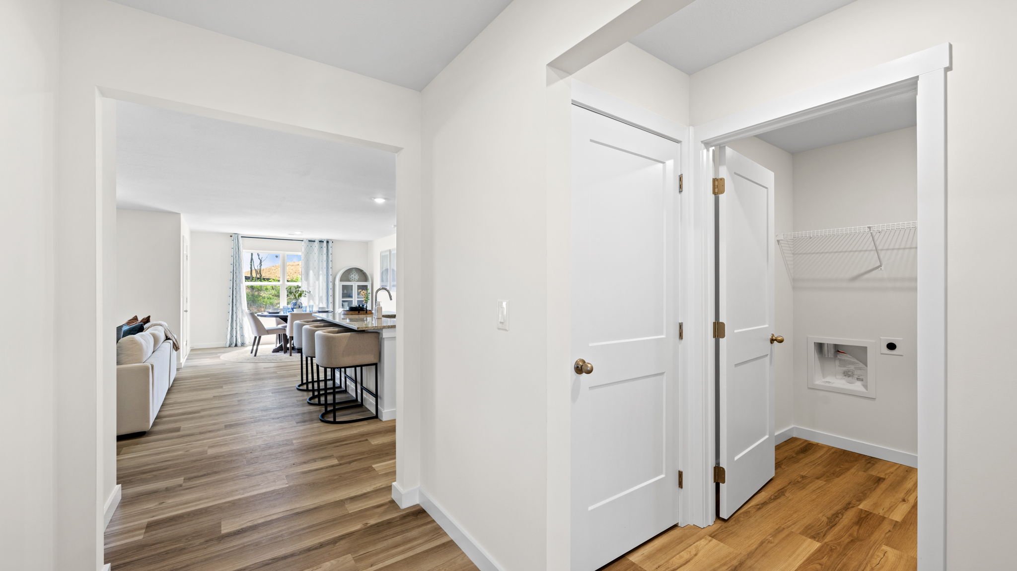 entryway hallway facing laundry and closet