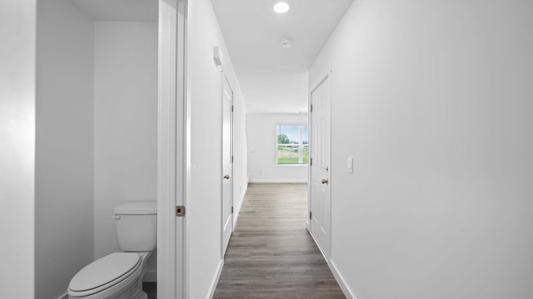 entryway hallway with half bathroom