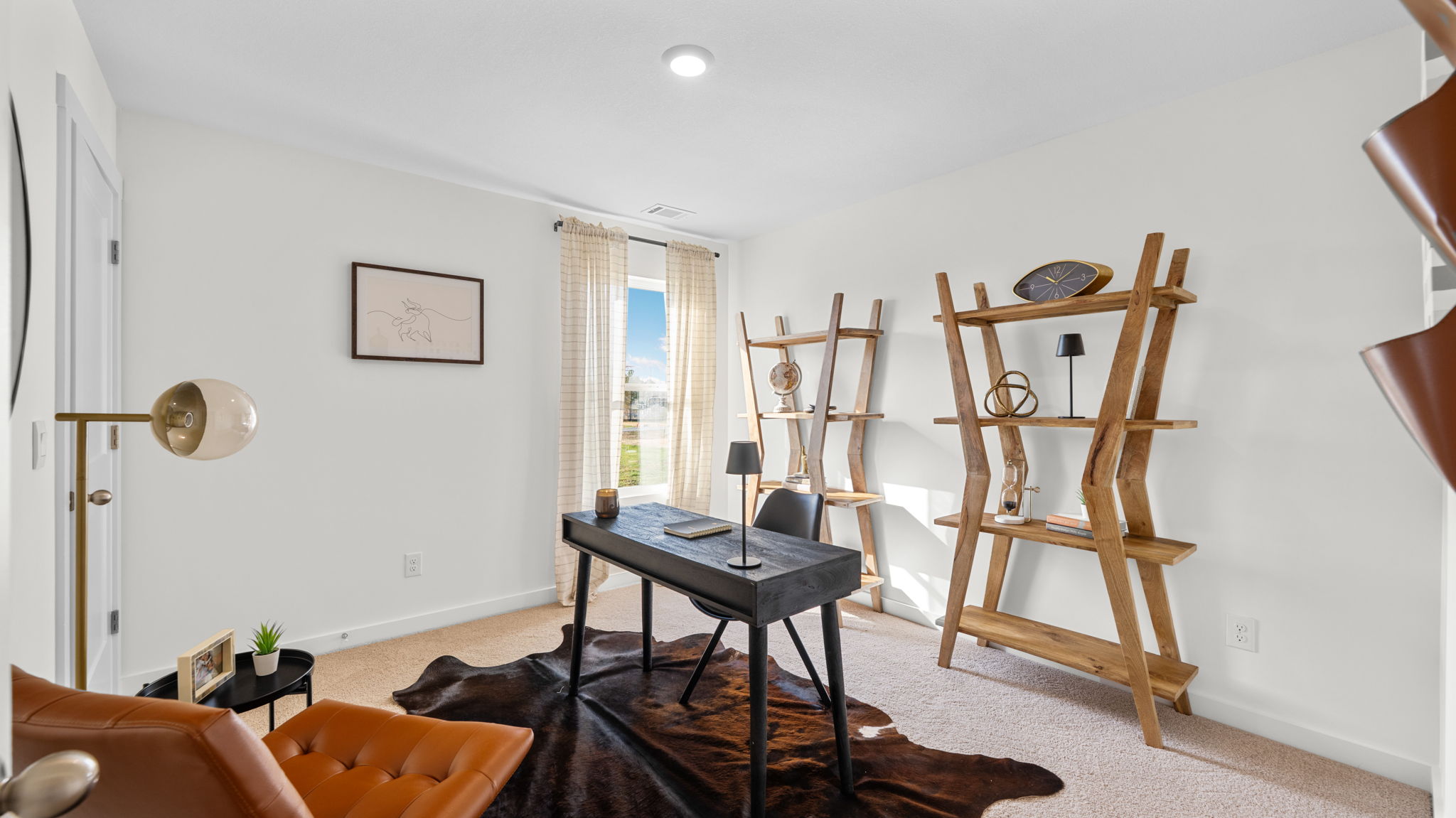 office/ bedroom with single window and walk-in closet