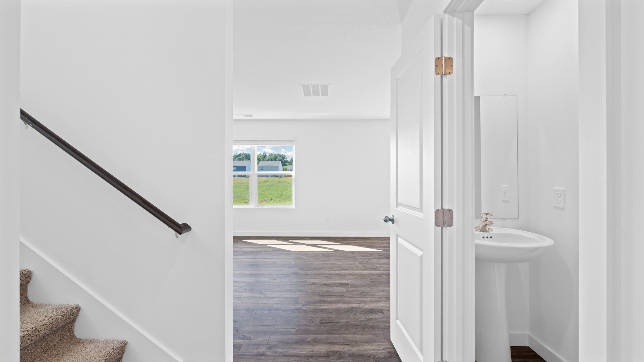 entryway hallway with staircase to the left