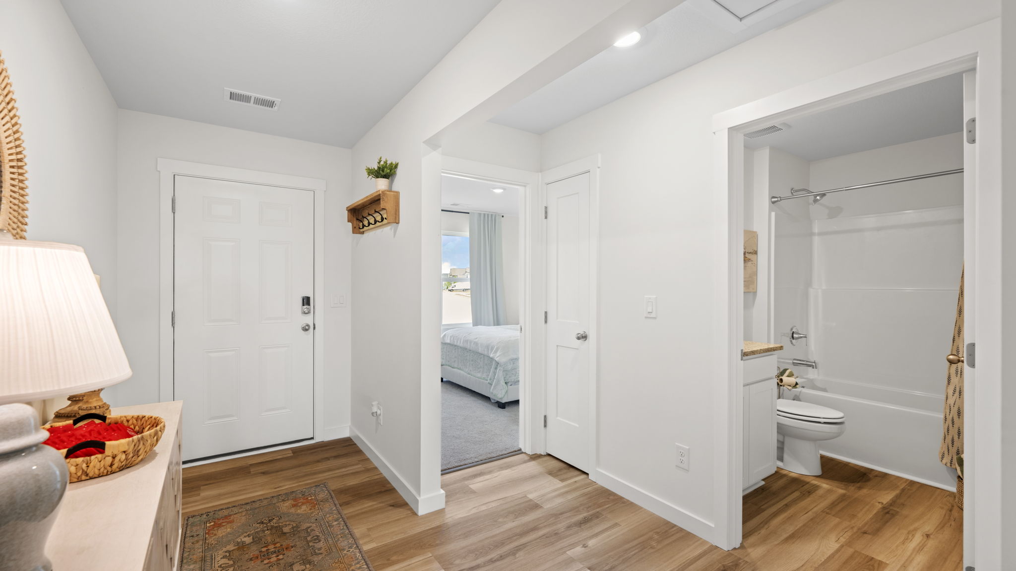 entryway with bedrooms and half bath