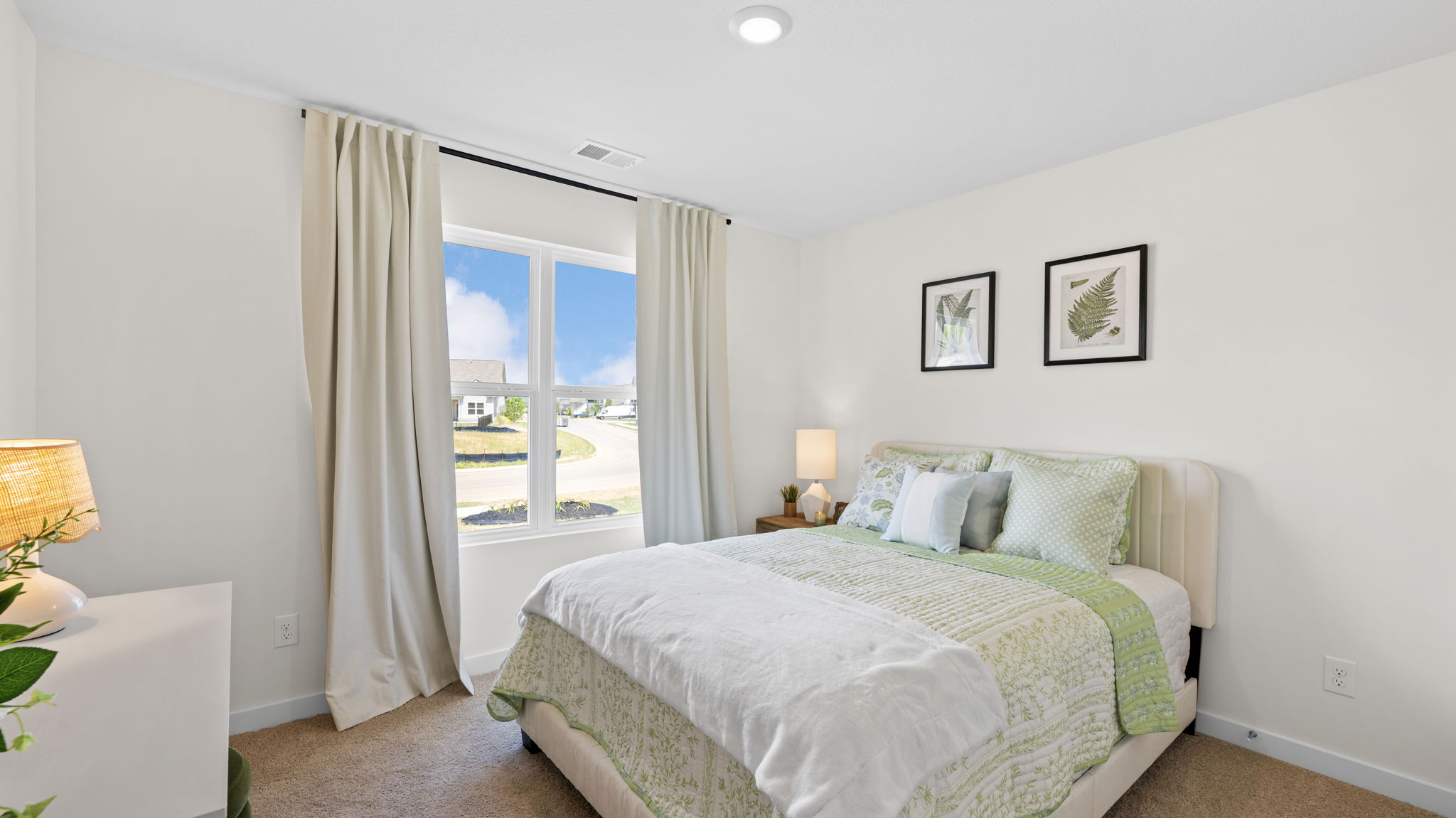 bedroom with double window and closet