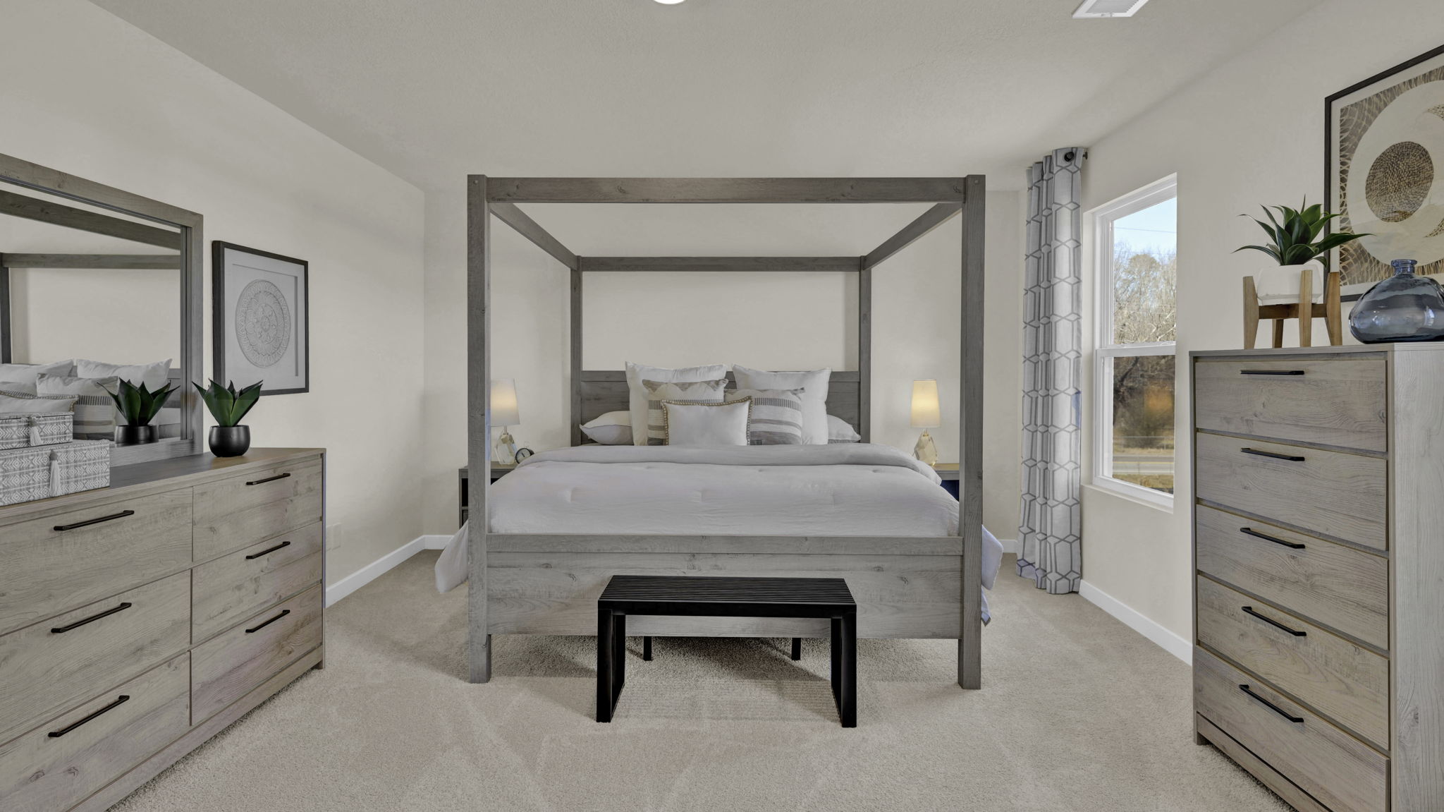 primary bedroom with two single windows and en suite