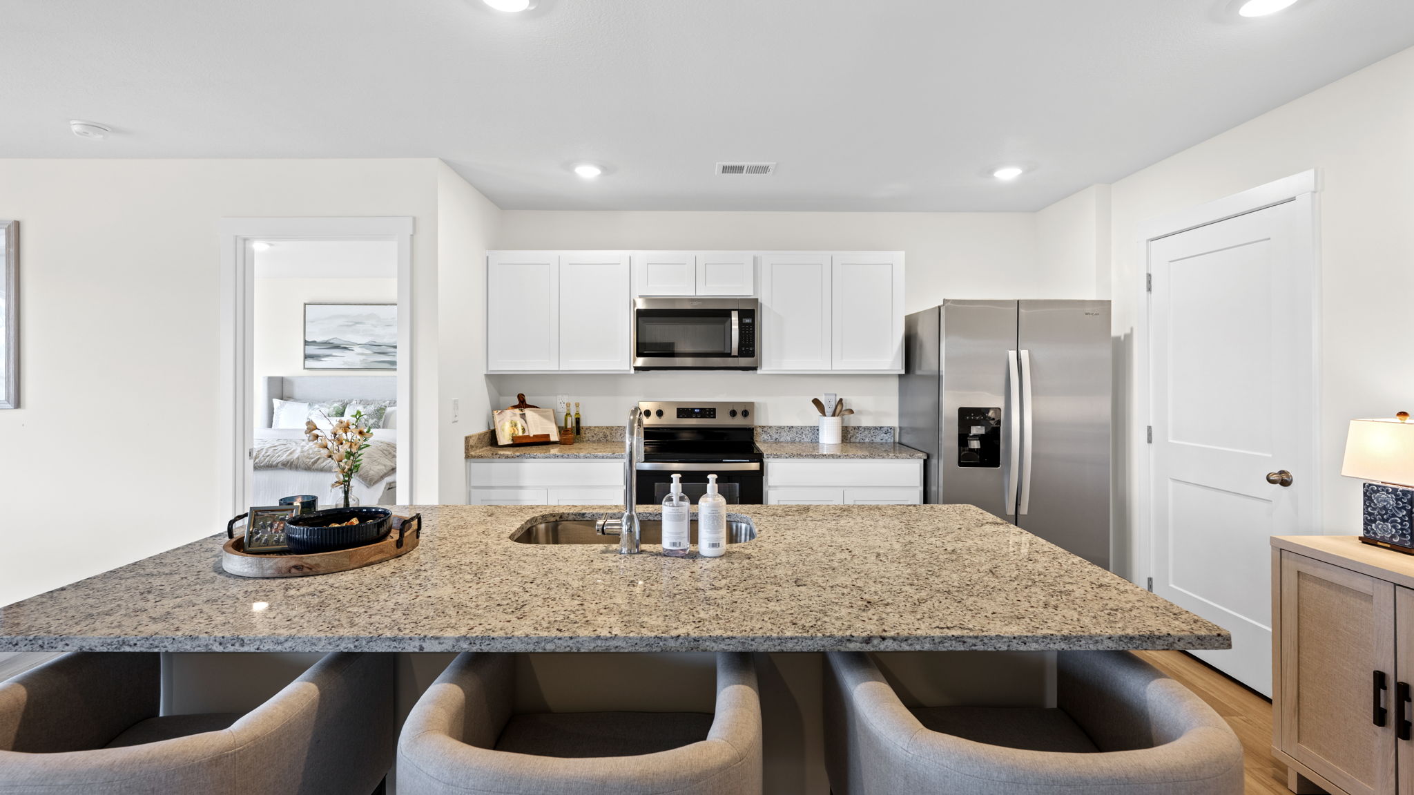 open concept kitchen with large island and stainless steel appliances