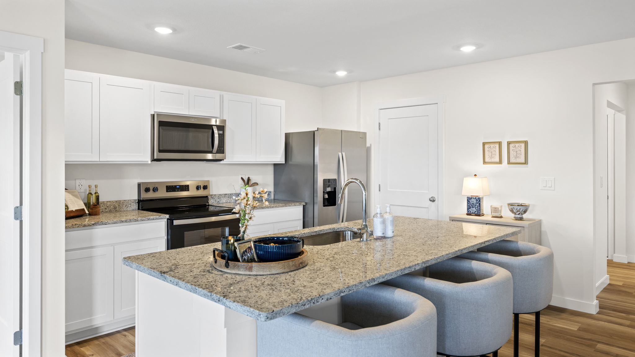 open concept kitchen with large island and stainless steel appliances