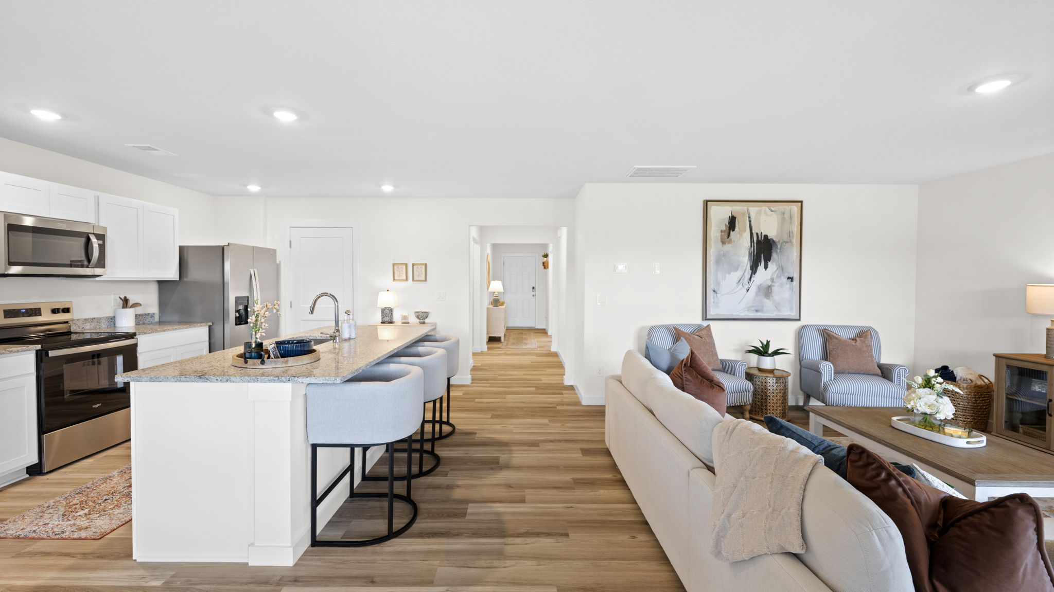 open concept kitchen with large island and stainless steel appliances