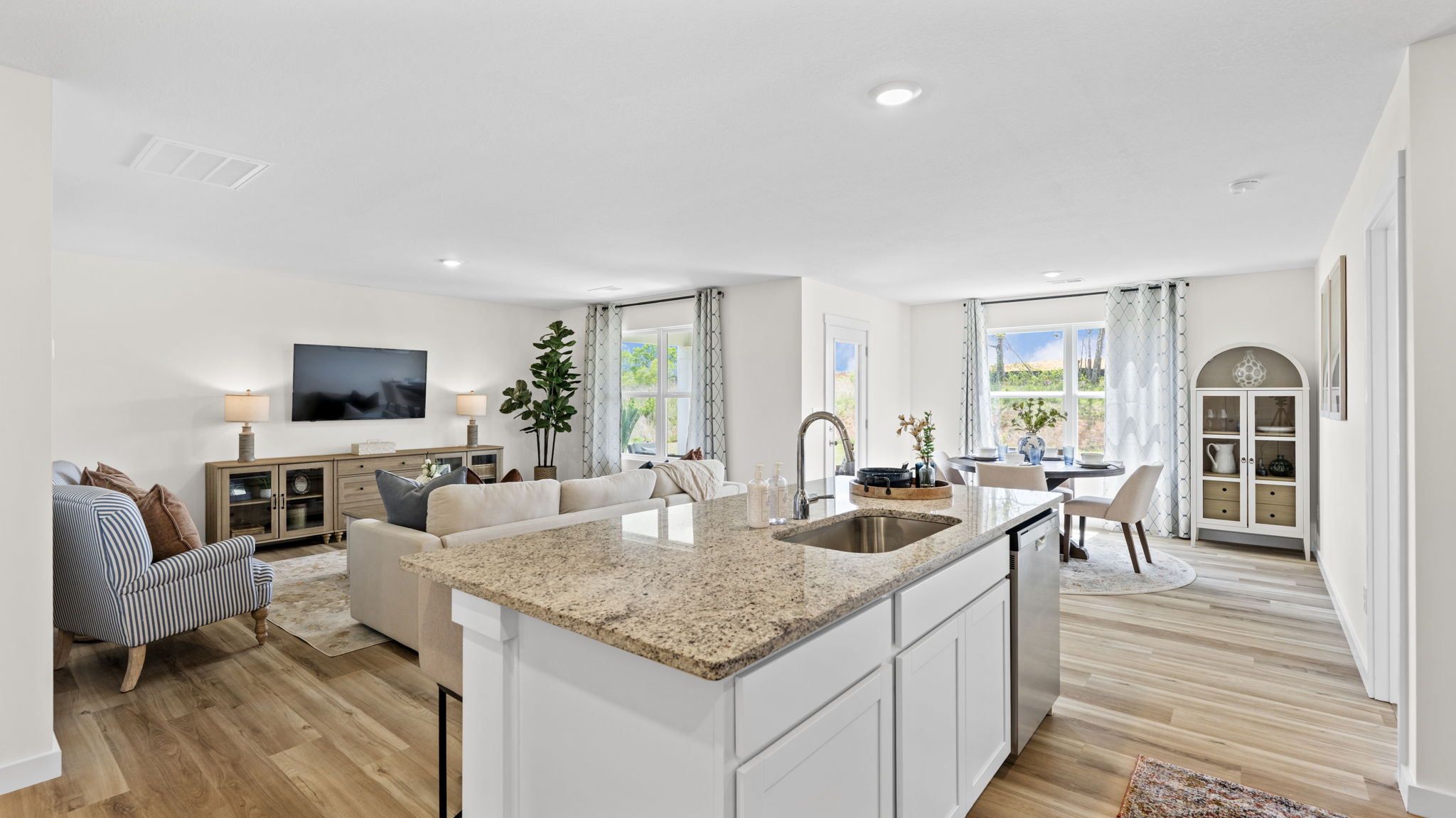 open concept kitchen with large island and stainless steel appliances