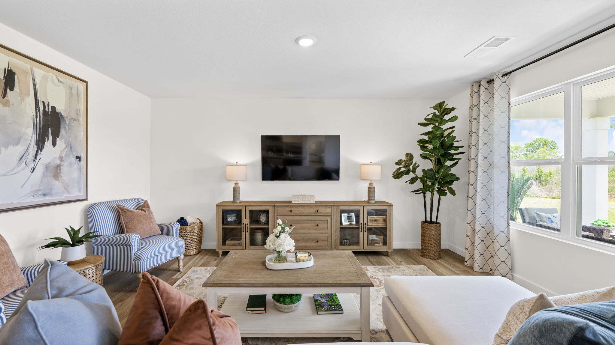 open concept living area with double window