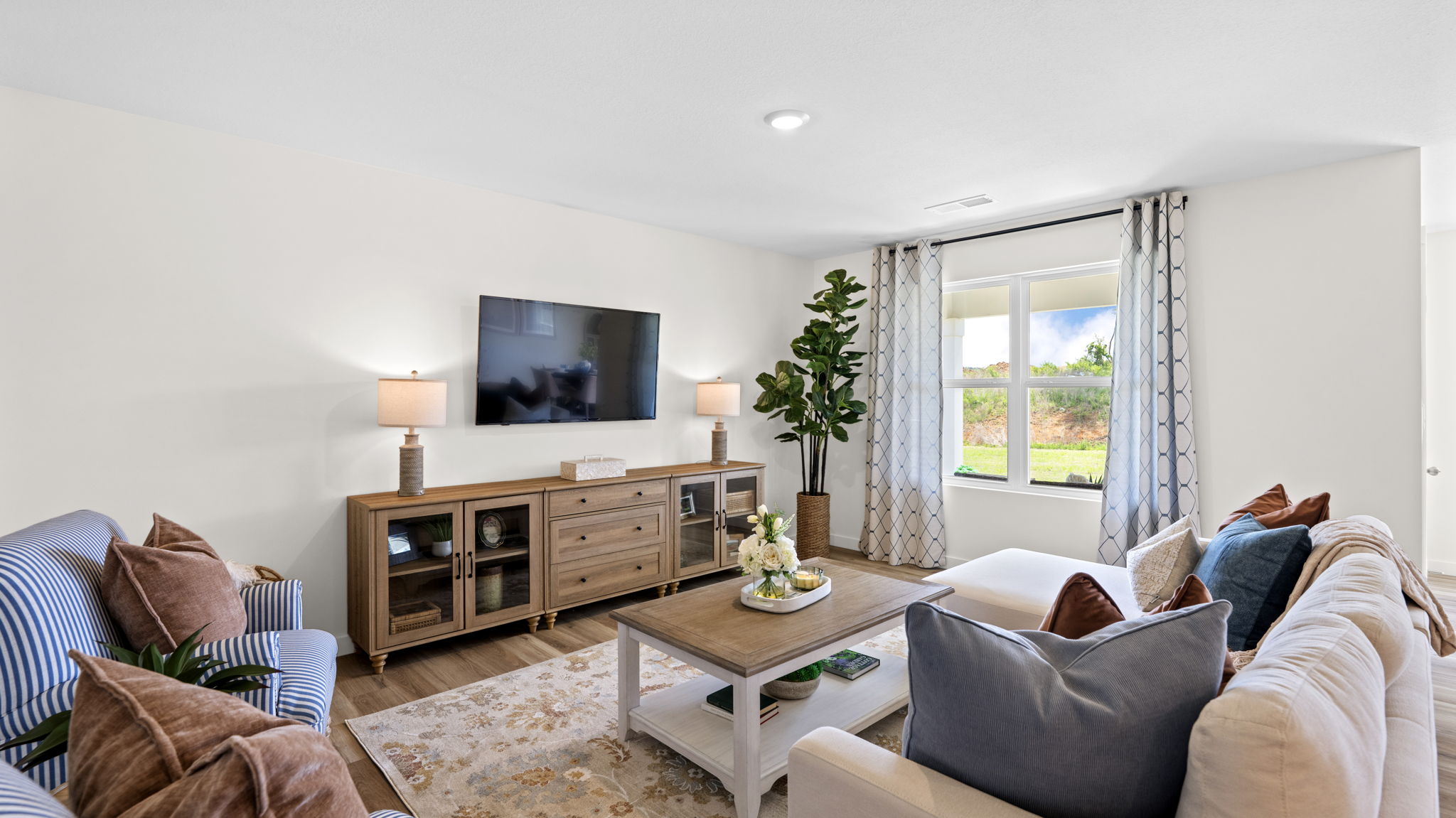 open concept living area with double window