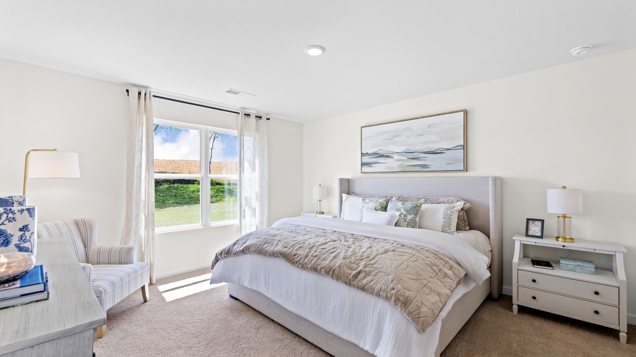primary bedroom with double window and en suite