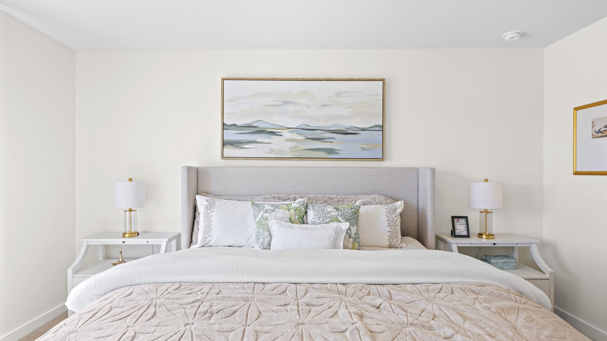 primary bedroom with double window and en suite