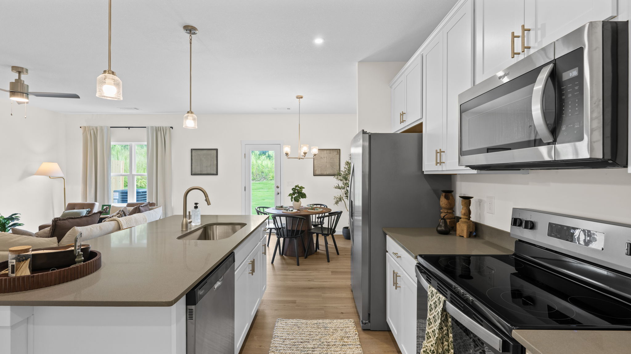 open concept kitchen with large island and stainless steel appliances