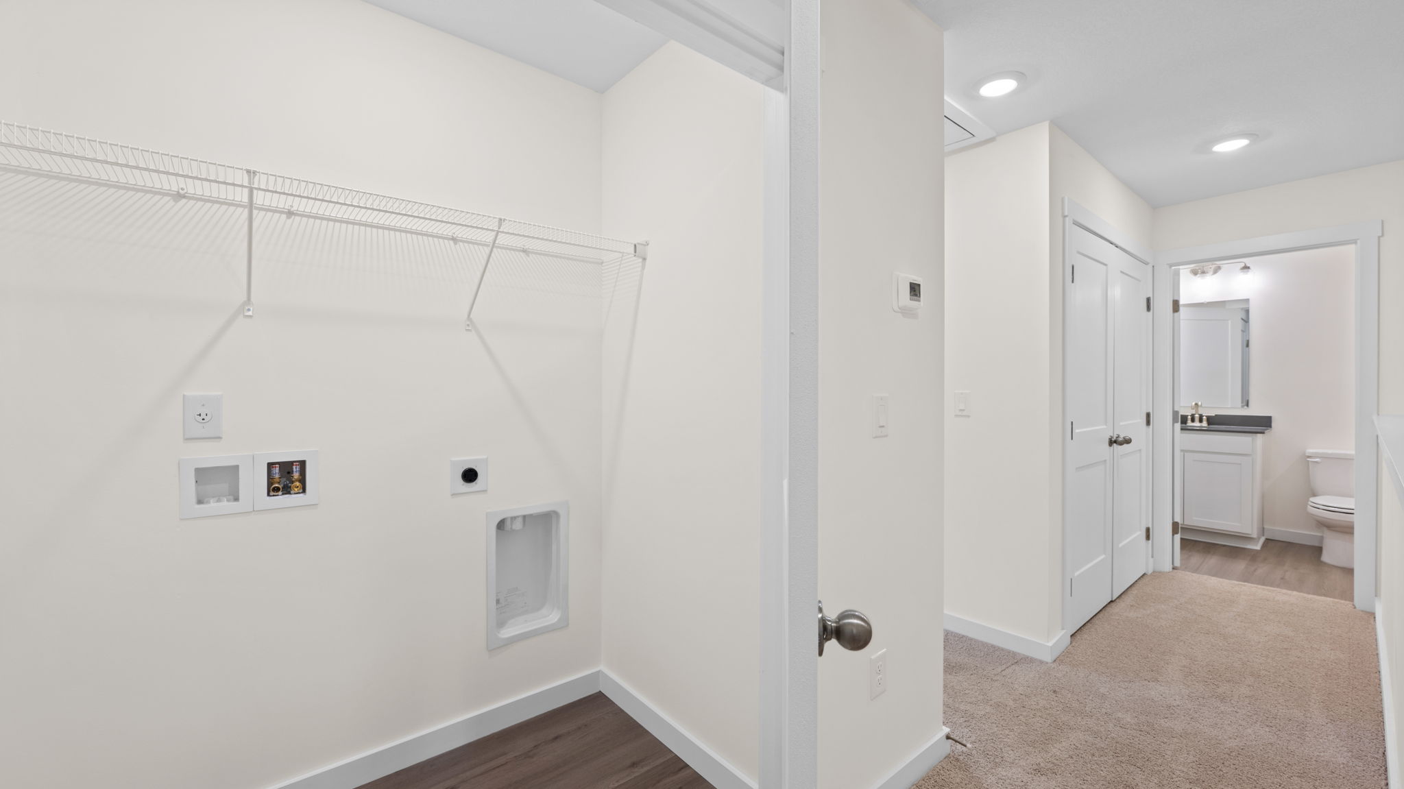 upstairs hallway with carpet