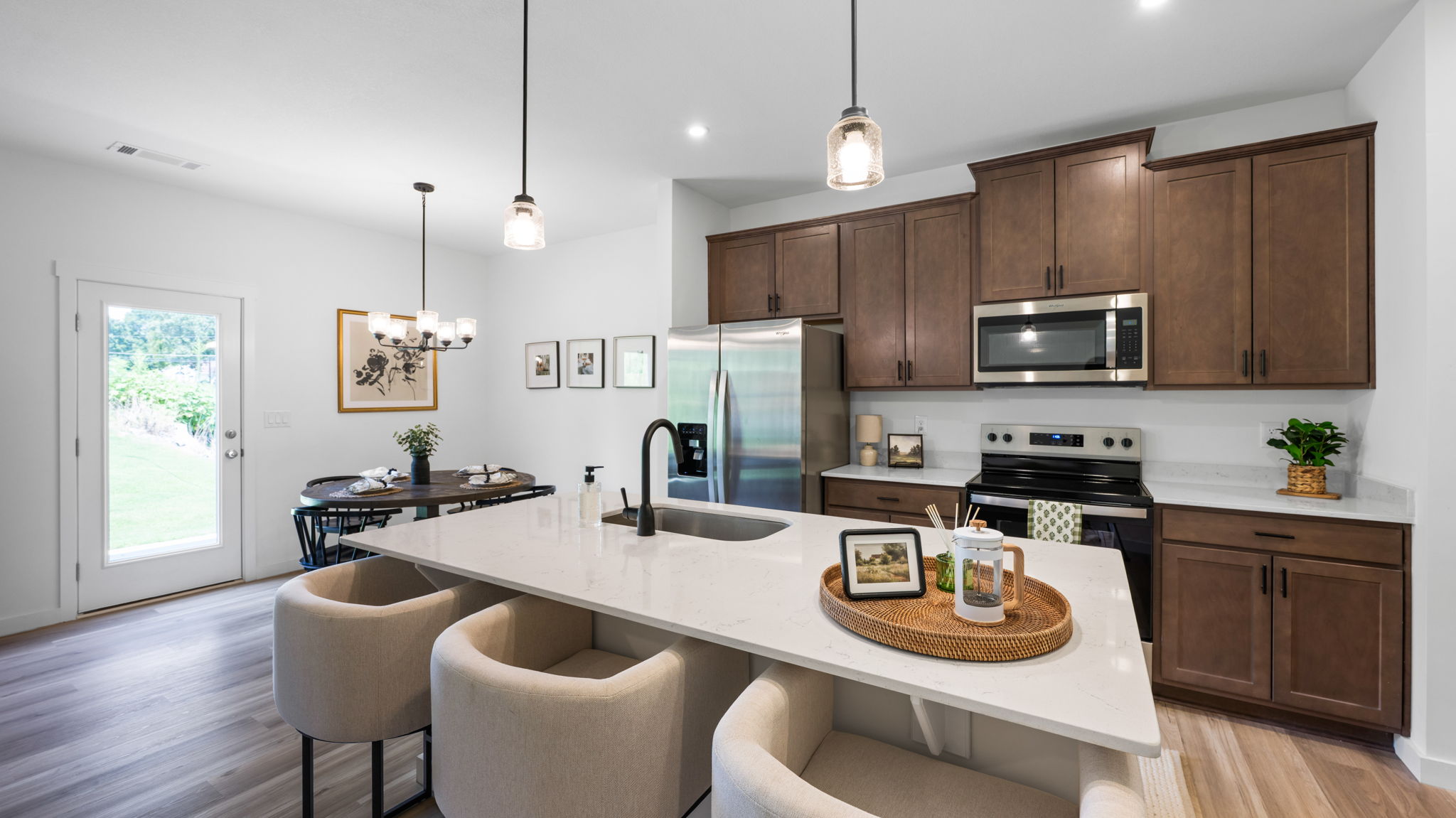 open concept kitchen with large island and stainless steel appliances