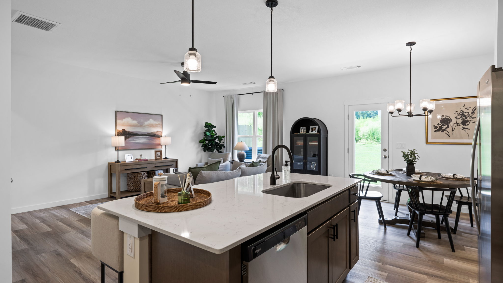 open concept kitchen with large island and stainless steel appliances
