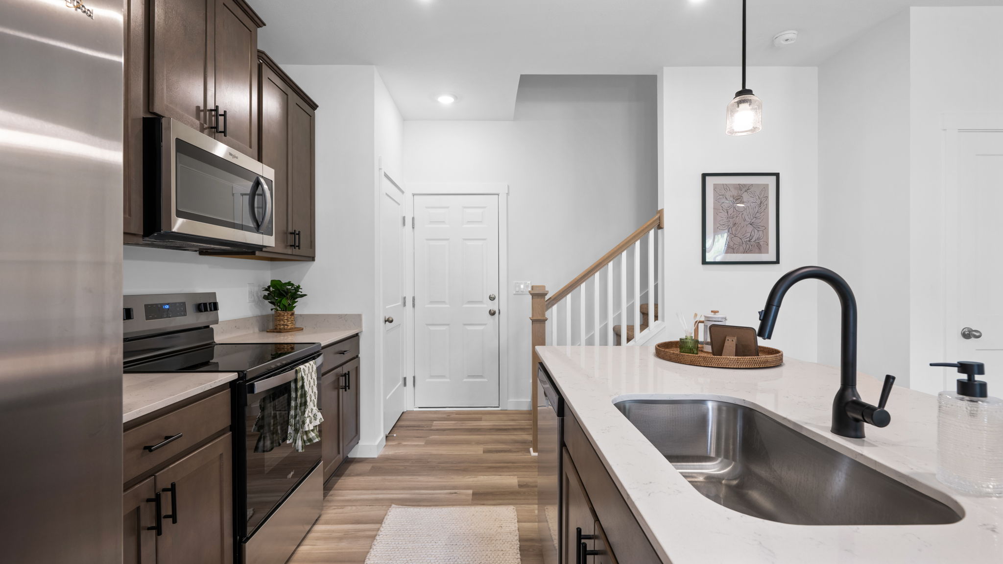 open concept kitchen with large island and stainless steel appliances