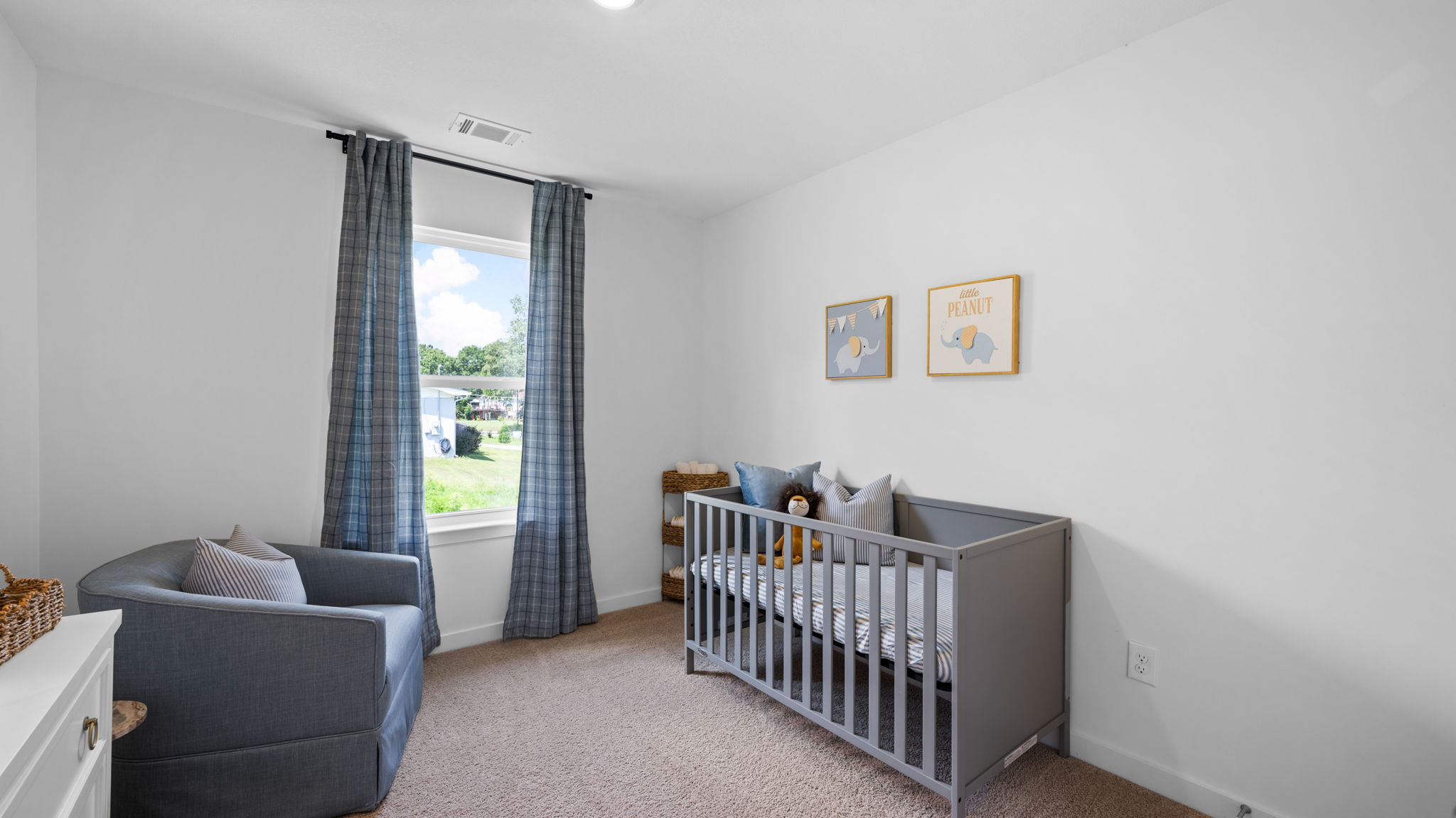 bedroom with single window and crib