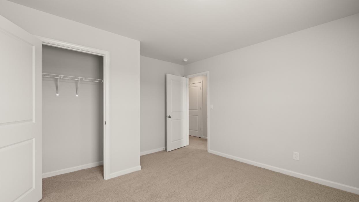 bedroom with single window and closet