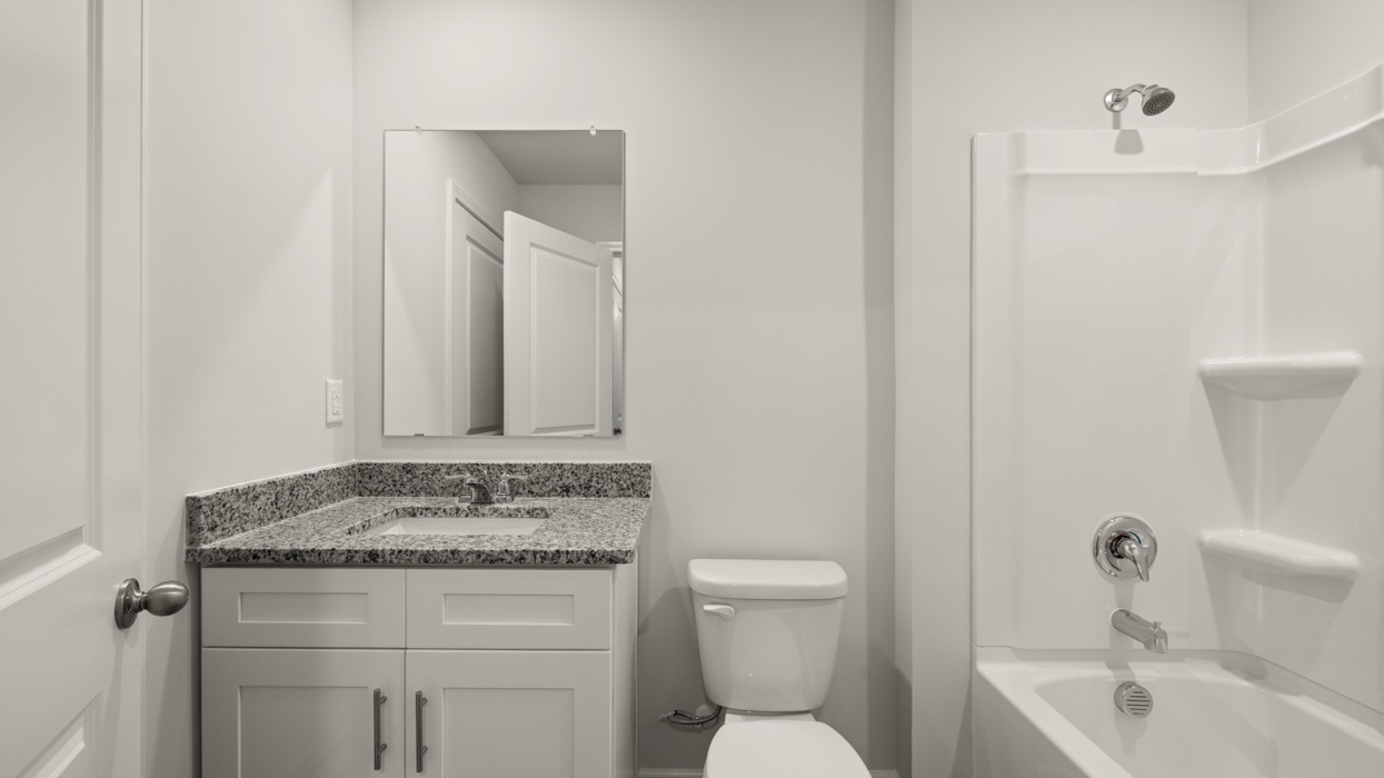 full bathroom with single vanity and shower/ tub duo