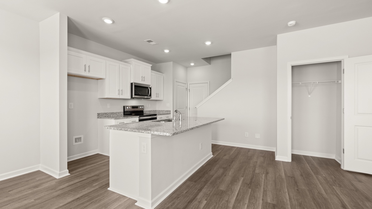 open concept kitchen with large island and stainless steel appliances