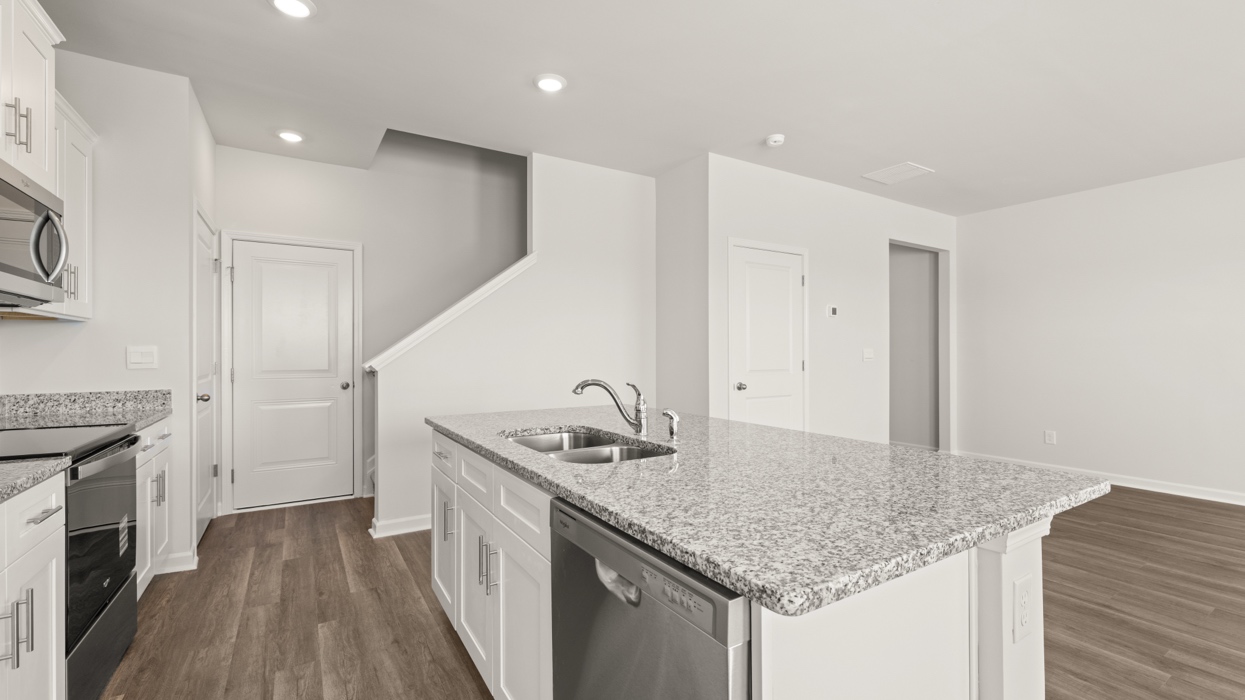 open concept kitchen with large island and stainless steel appliances