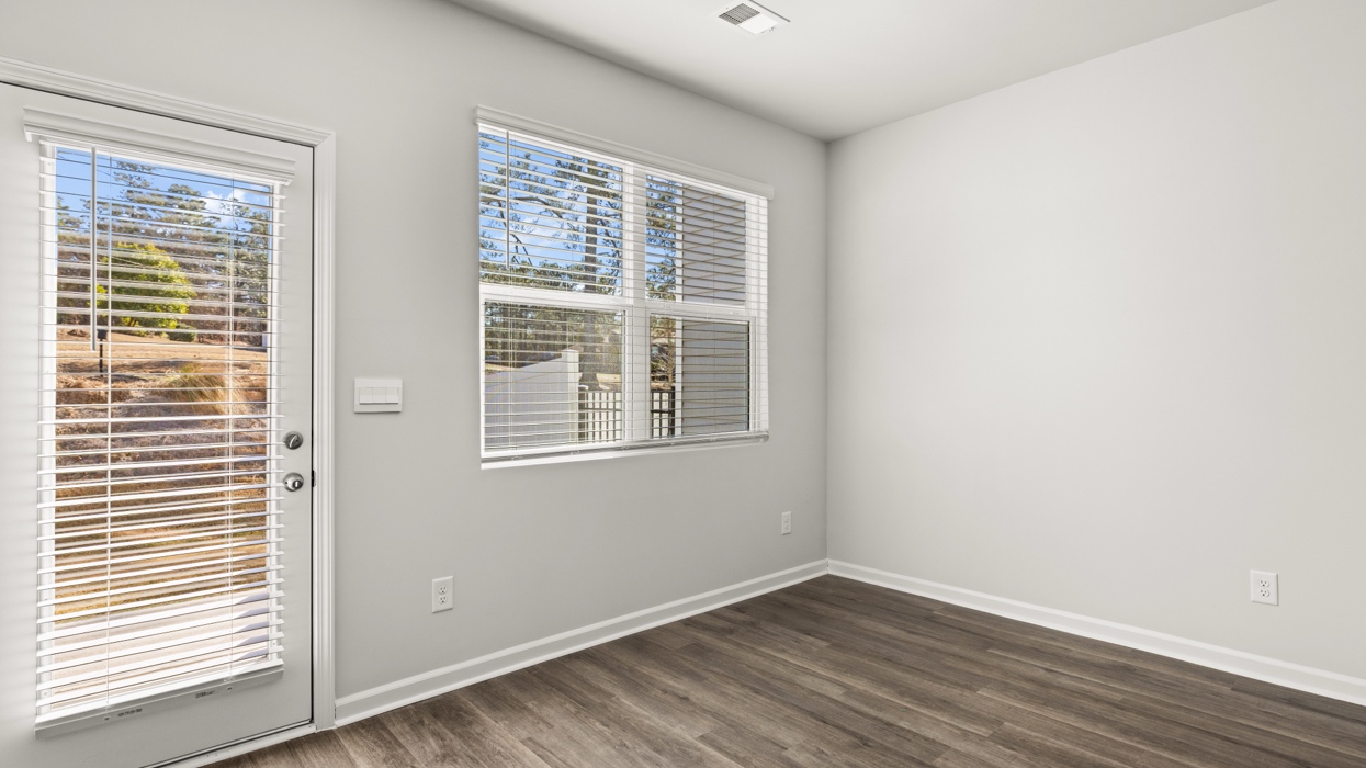 dining area with double window and back patio door